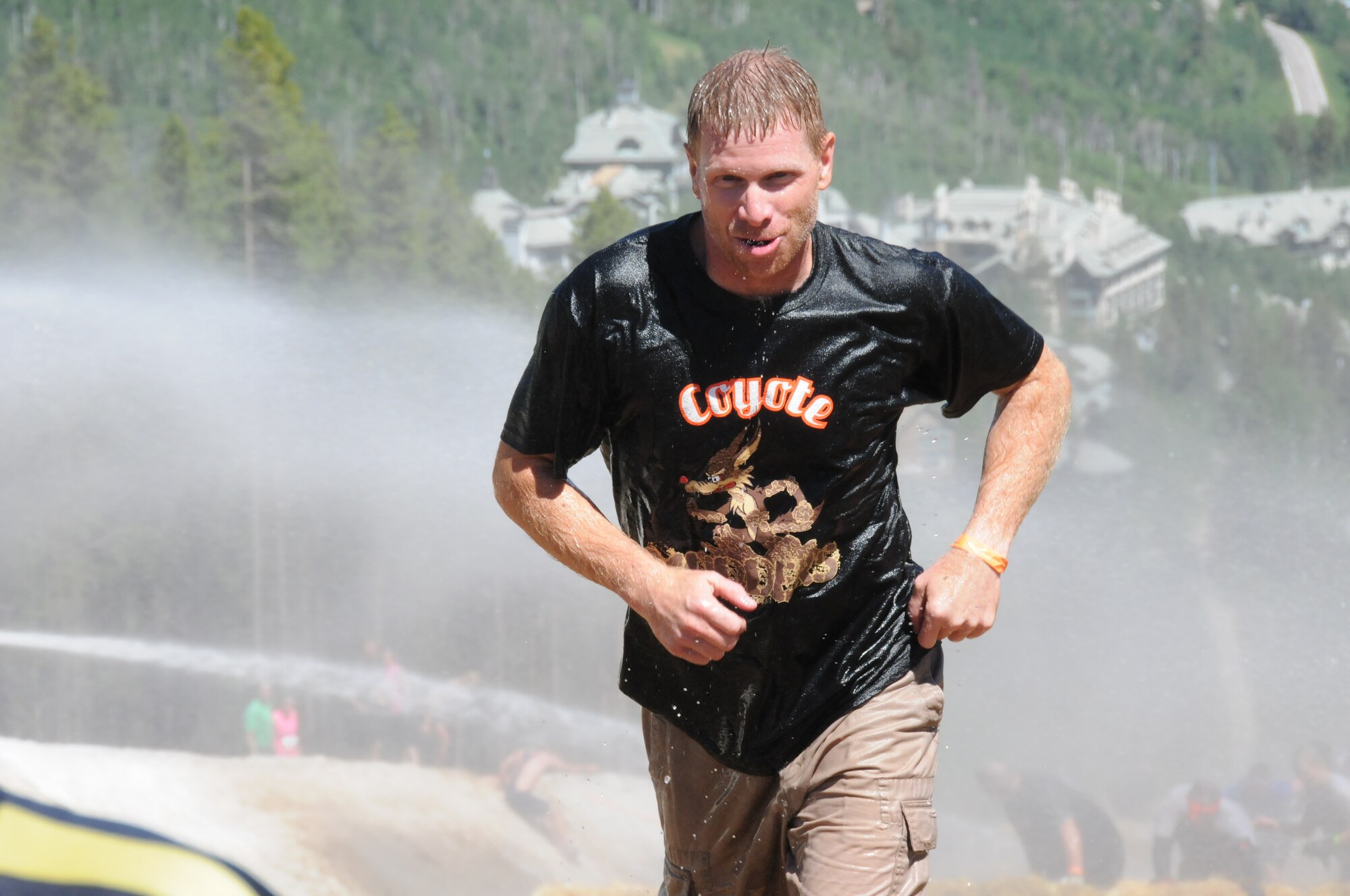 Master Sgt. Doug Hickman nearing the end of one of the many obstacles in the Tough Mudder course. (photos by Master Sgt. Allen Pickert)