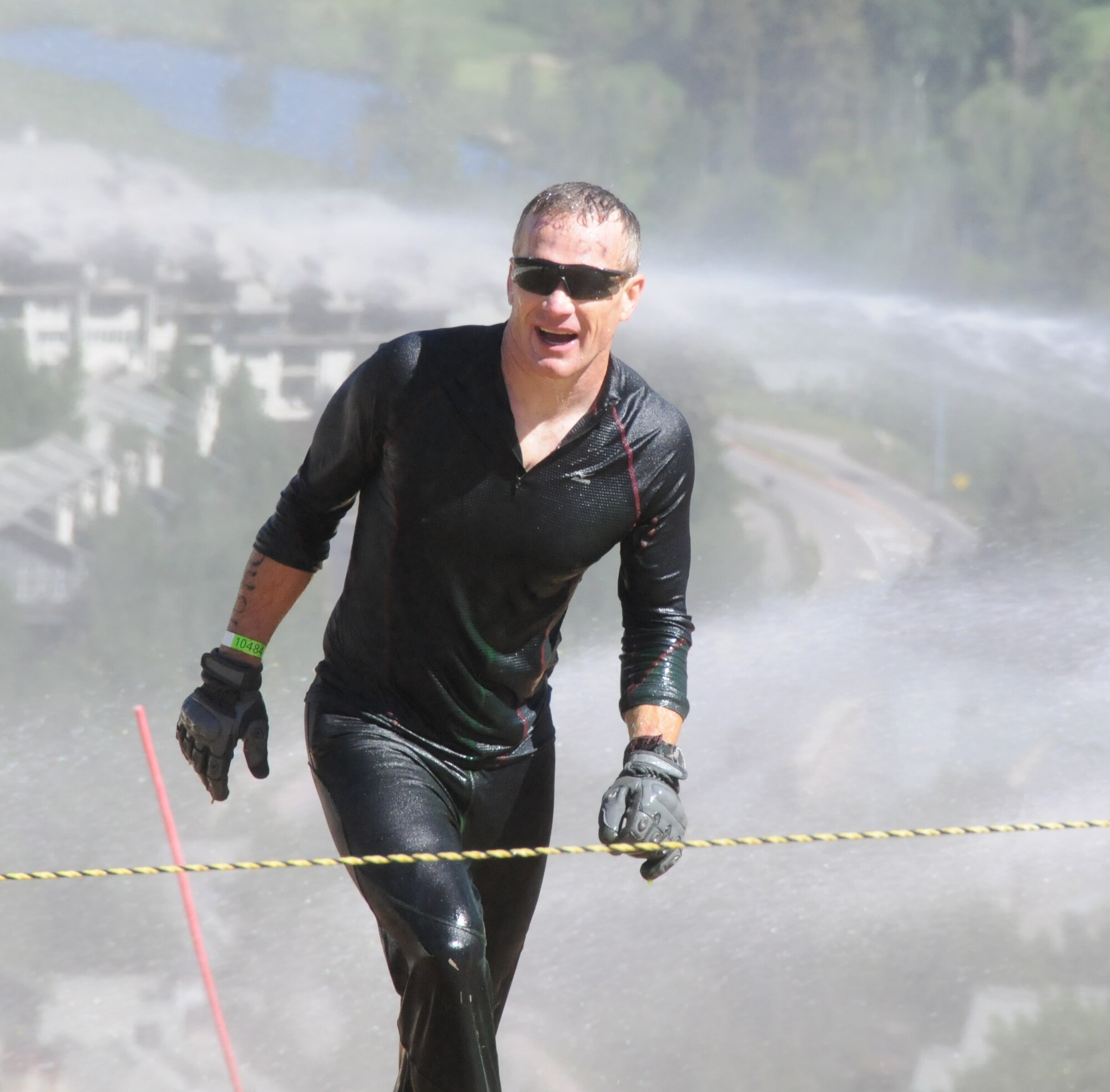 Col. Derek Rogers catches his breath after finishing an obstacle.