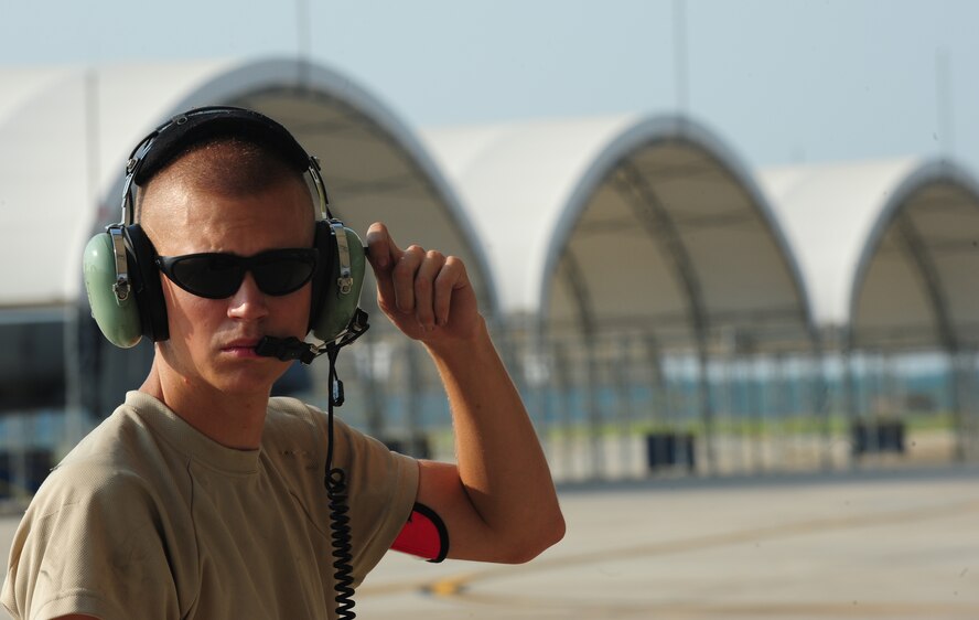 U.S. Air Force Airman First Class Eric Eckmann, 23rd Aircraft Maintenance Squadron crew chief, waits for his turn to launch an A-10C Thunderbolt II at Moody Air Force Base, Ga., Aug. 3, 2011. Crew chiefs are responsible for ensuring everything from the tip to tail of the aircraft is maintained to the most rigorous standards. (U.S. Air Force photo by Senior Airman Stephanie Mancha/Released)