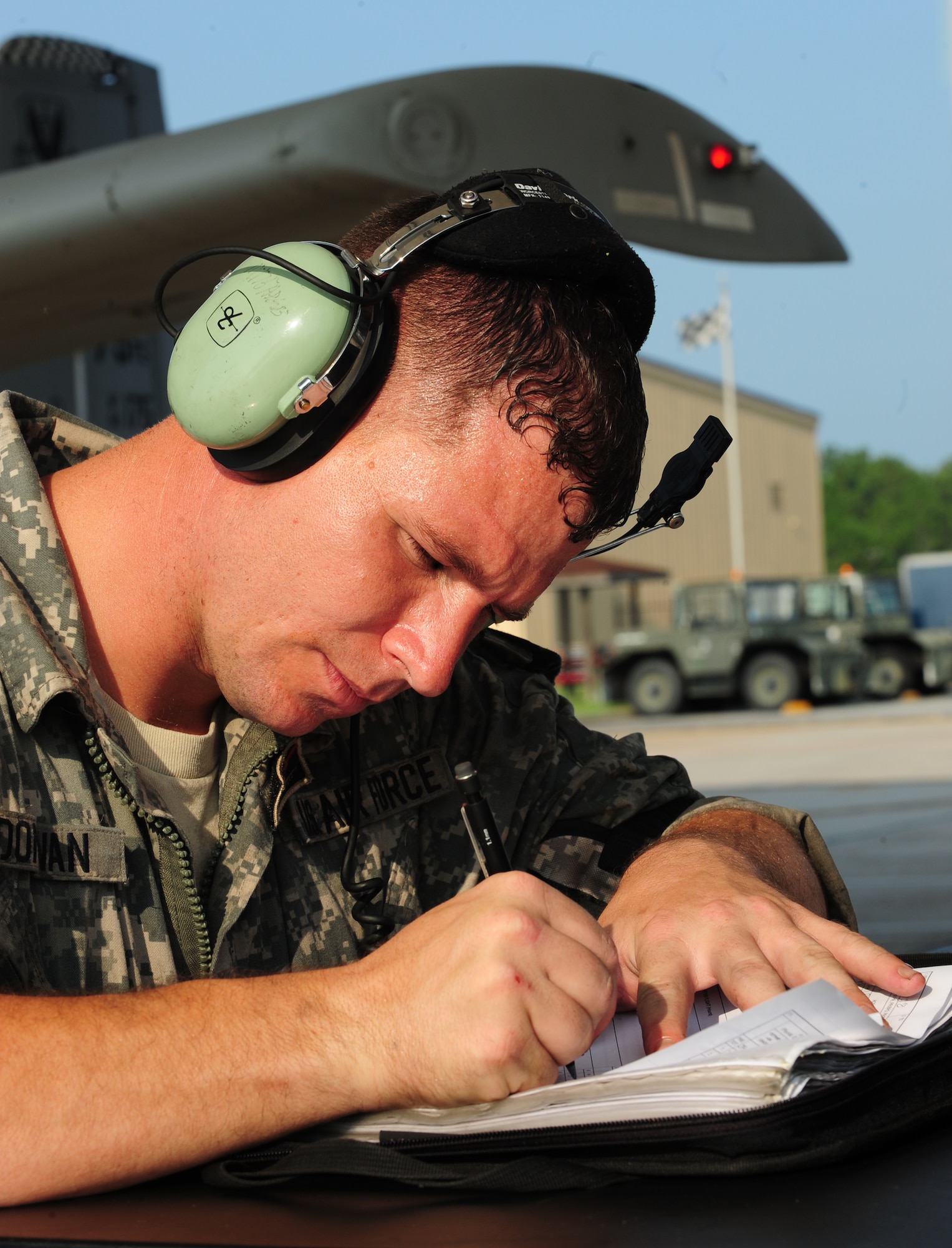 U.S. Air Force Staff Sgt. Kevin Donovan, 23rd Aircraft Maintenance Squadron crew chief, fills out post-flight paperwork for a pilot debrief at Moody Air Force Base, Ga., Aug. 3, 2011. Donovan has been a crew chief for nine years and has been stationed at Moody for half of that time. (U.S. Air Force photo by Senior Airman Stephanie Mancha/Released)