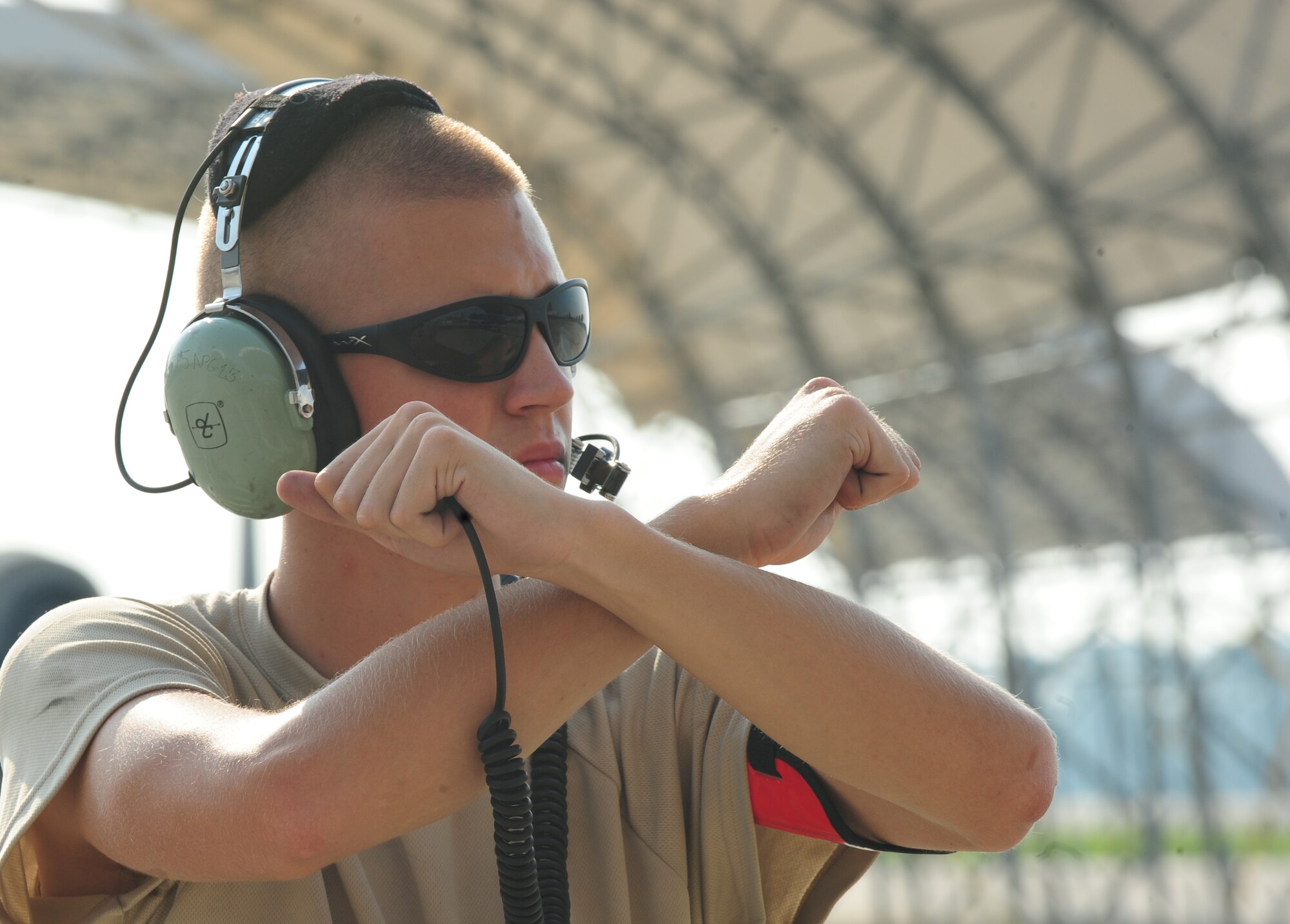 U.S. Air Force Airman 1st Class Eric Eckmann, 23rd Aircraft Maintenance Squadron crew chief, marshals an A-10C Thunderbolt II to taxi at Moody Air Force Base, Ga., Aug. 3, 2011. Eckmann has been at Moody a little more than a month and is working toward his 5-skill level. (U.S. Air Force photo by Senior Airman Stephanie Mancha/Released)