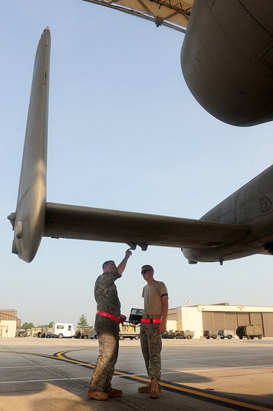 U.S. Air Force Staff Sgt. Kevin Donovan, left, and Airman First Class Eric Eckmann, 23rd Aircraft Maintenance Squadron crew chiefs, inspect an A-10C Thunderbolt II aircraft before a flight at Moody Air Force Base, Ga., Aug. 3, 2011. Donovan gave Eckmann on-the-job training while preparing the aircraft for the pilot. (U.S. Air Force photo by Senior Airman Stephanie Mancha/Released)