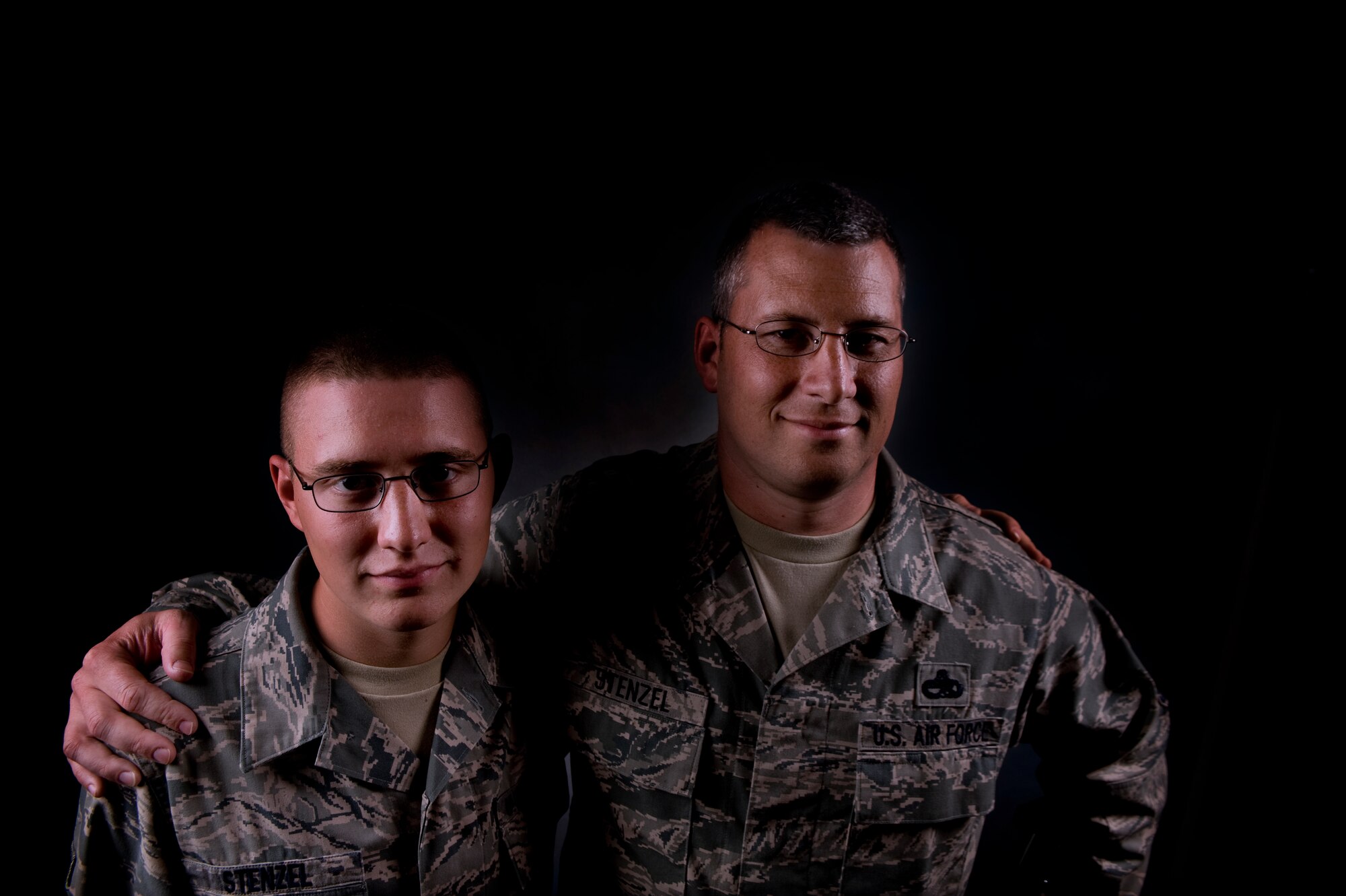 Master Sgt. Mark Stenzel and his son, Airman 1st Class Cory Stenzel are pictured together July 27 at Fairchild. They are both stationed here after being apart for five months while Cory attended basic and technical school training. (U.S. Air Force photo/Staff Sgt. Michael Means)