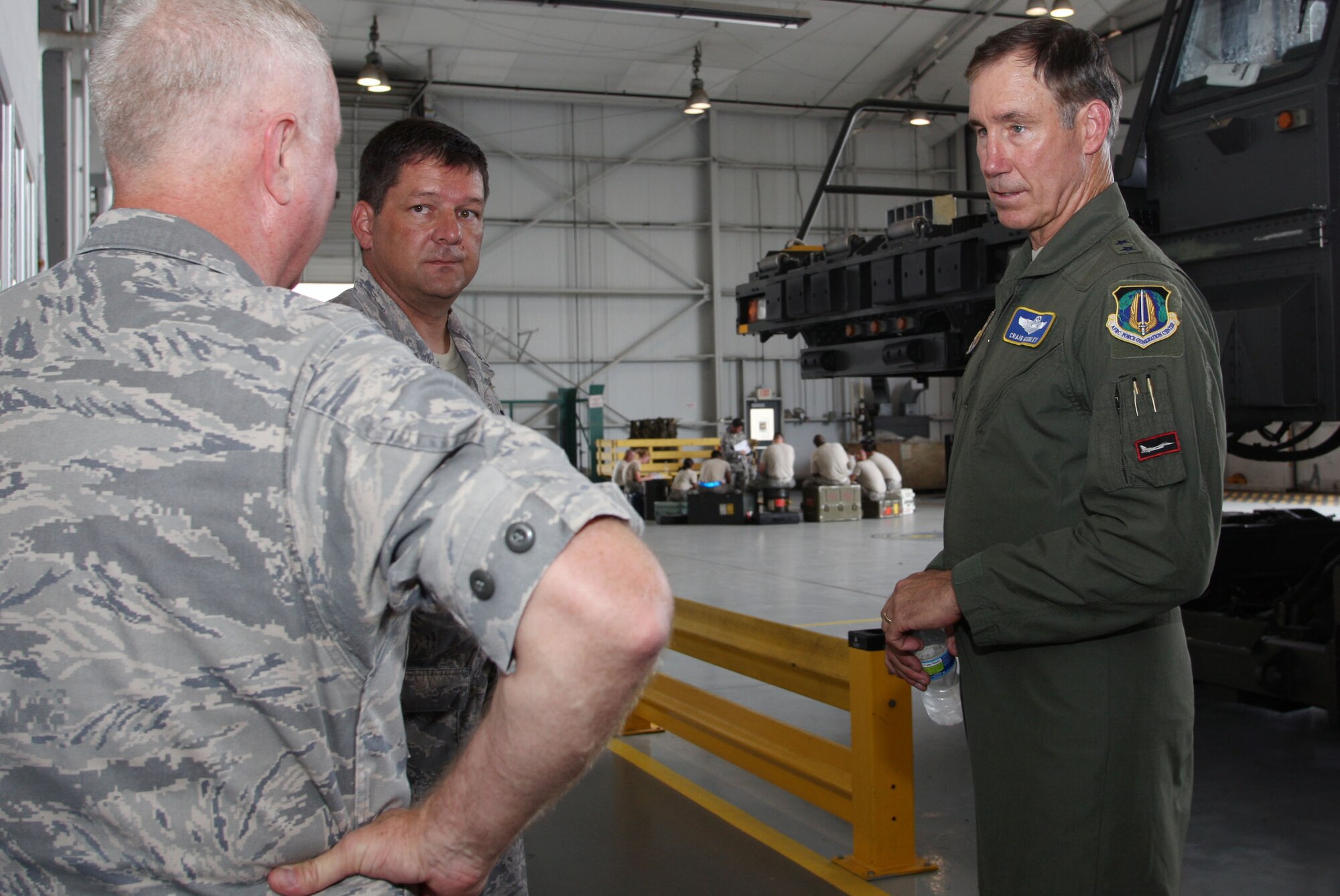 Staff members of the Transportation Proficiency Center show off their facility to visiting Maj. Gen. Craig N. Gourley Aug. 2. (U.S. Air Force Photo/Don Peek)