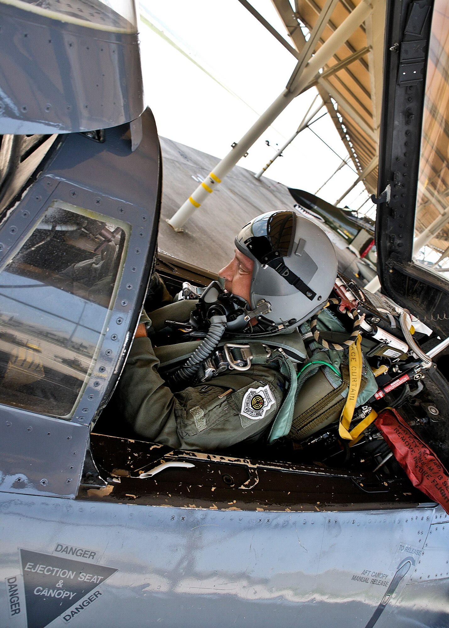 Col. David Hicks, the 53rd Wing commander, straps in to fly a QF-4 as part of the new commander's immersion of the 53rd Weapons Evaluation Group at Tyndall Air Force Base, Fla., Aug. 3.  The 53rd Wing have the only F-4s left in the Air Force inventory.  They are used as full-scale targets by the 82nd Aerial Targets Squadron during the Weapons System Evaluation Program known as Combat Archer.  (U.S. Air Force photo/Tech. Sgt. John Hoffmann) 