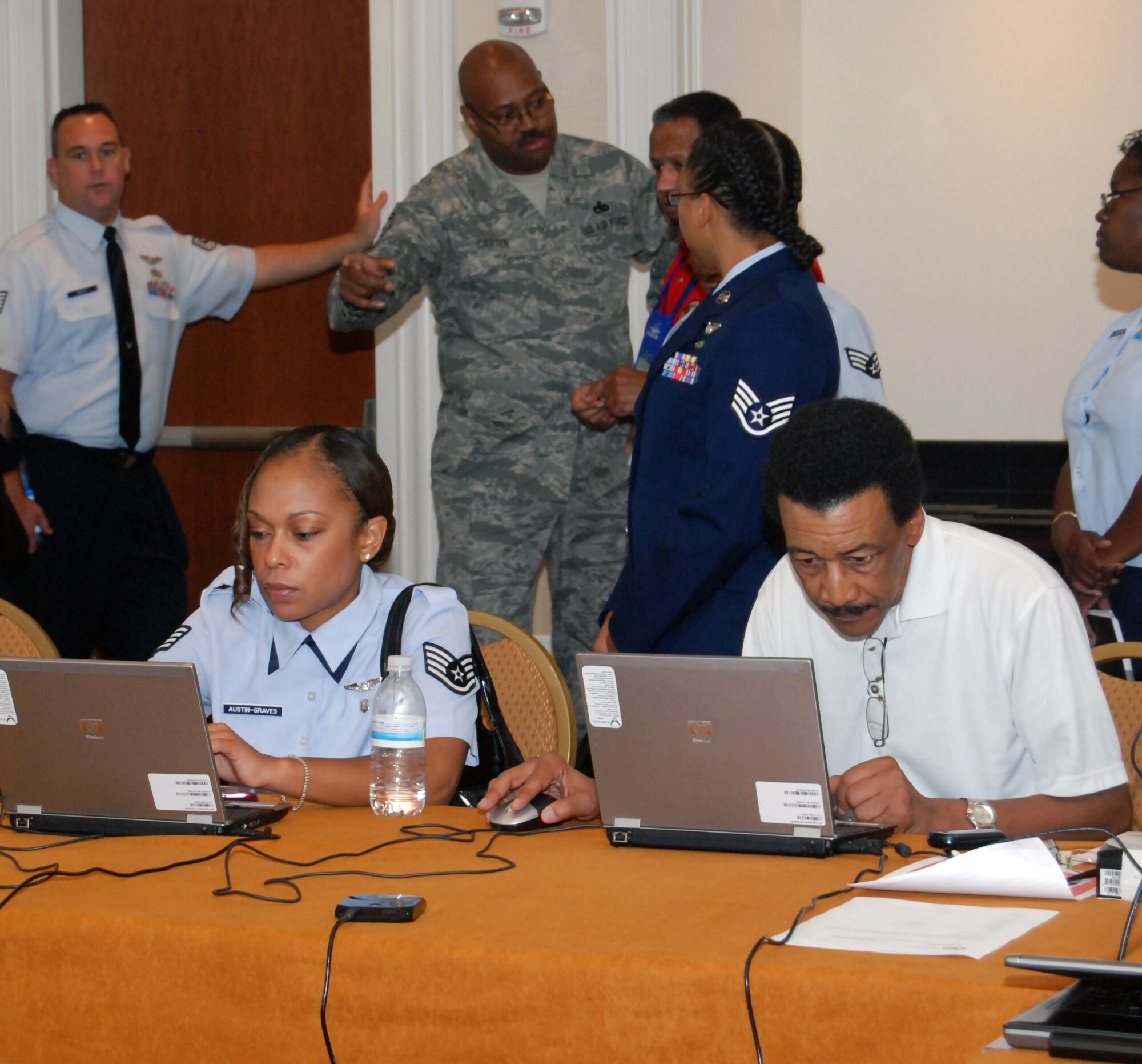 Participants of the 40th Annual Tuskegee Airmen Incorporated National Convention register at the command post. Several service members, retirees and their families from Dobbins and around the world came together for day one of the 40th Annual Tuskegee Airman Incorporated National Convention at the Gaylord National Hotel and Convention Center in National Harbor, MD, Aug. 3. (U.S. Air Force photo/Senior Airman Danielle Campbell)