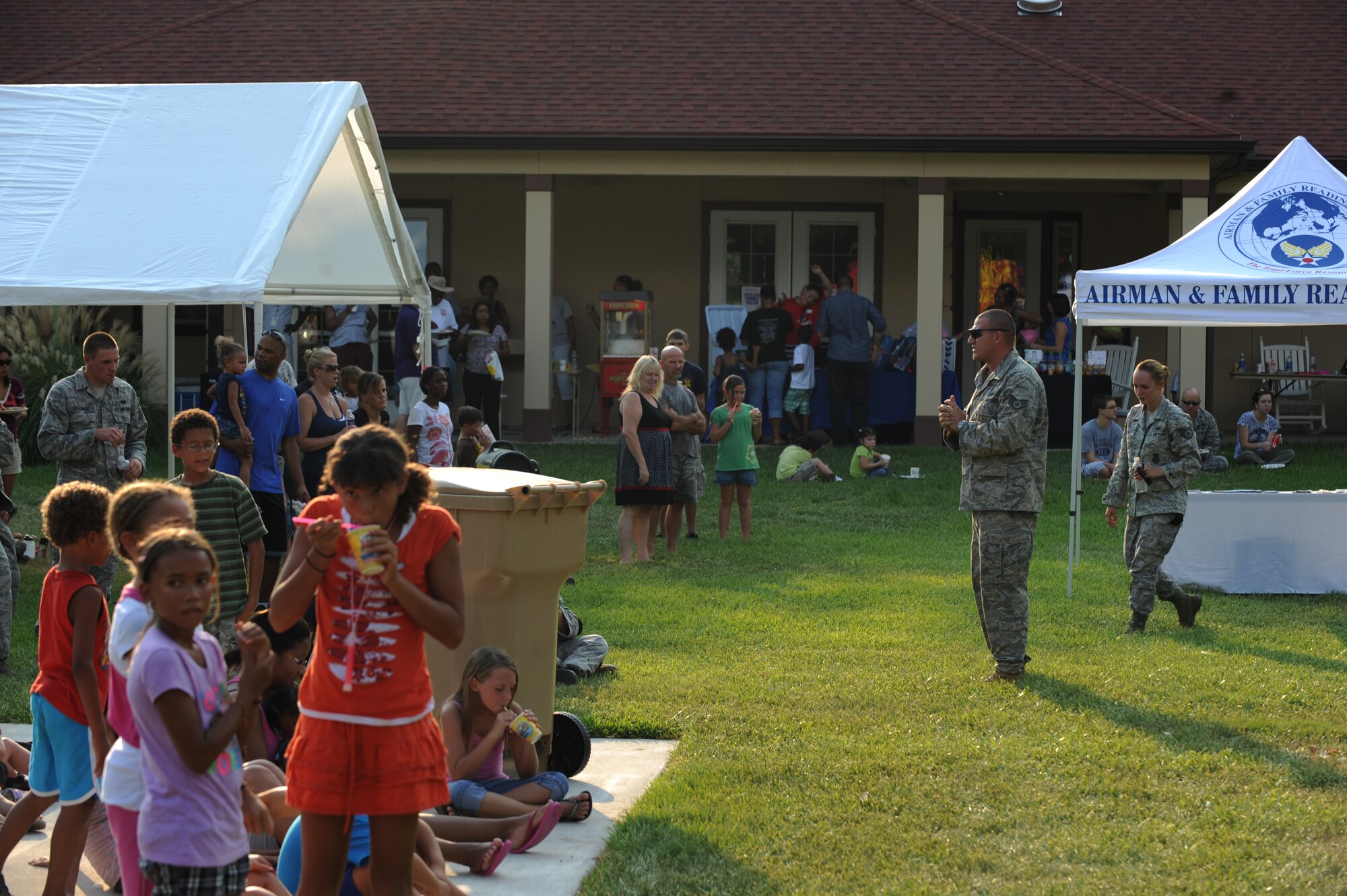 Staff Sgt. Clayton Tibbets, 2nd Security Forces Squadron, narrates during the K-9 demonstration for the National Night Out crowd on Barksdale Air Force Base, La., Aug. 2. Several organizations collaborated for the event to increase police awareness and fire prevention education. (U.S. Air Force photo/Airman 1st Class Micaiah Anthony)(RELEASED)
