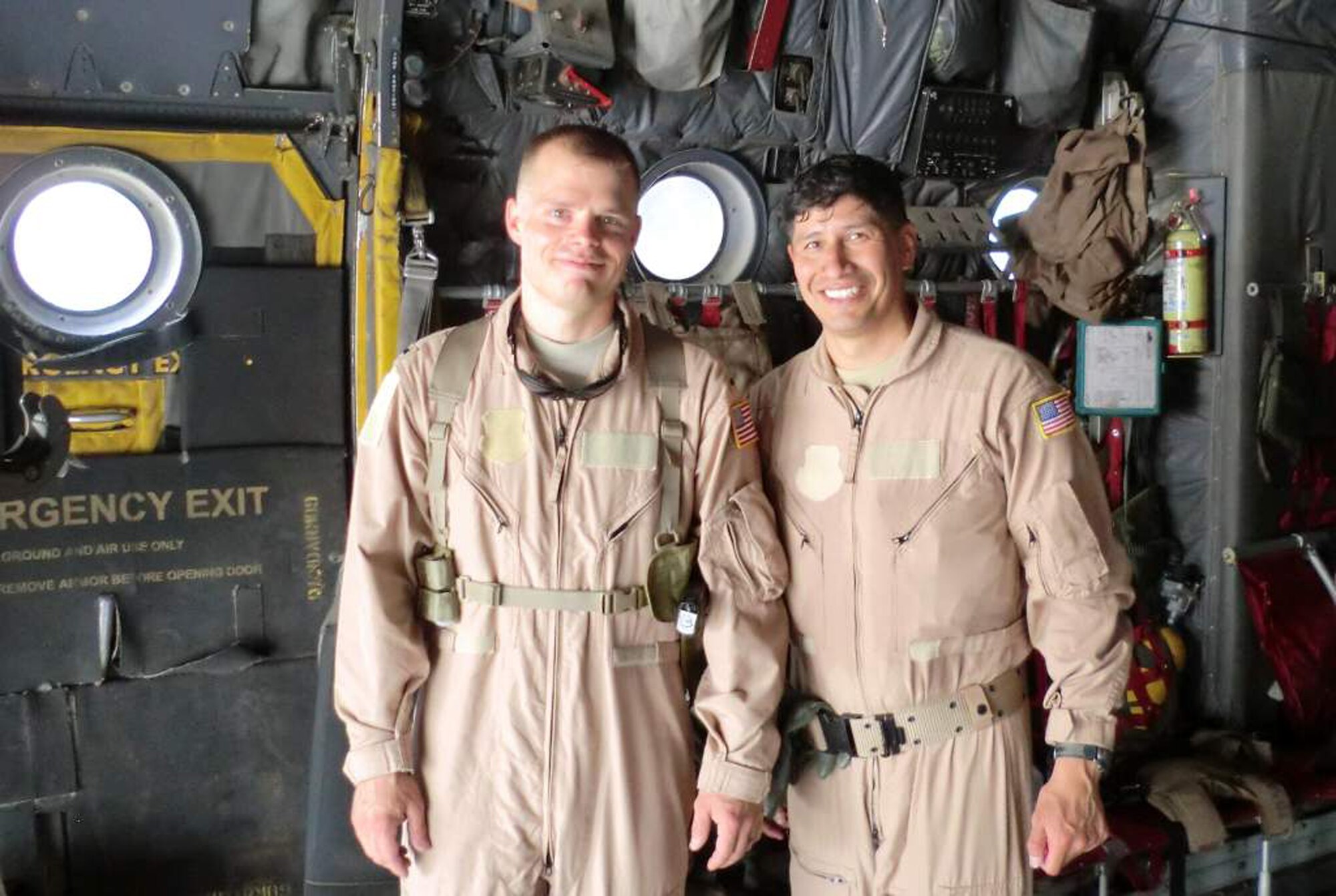 WRIGHT-PATTERSON AIR FORCE BASE, Ohio - First Lt. William Sikes, on the left, 445th Aeromedical Evacuation Squadron flight nurse, currently deployed with the 379th Expeditionary Aeromedical Evacuation Squadron, Southwest Asia, poses for a photo with fellow AES crewmember Master Sgt. Juan Saharigwas, during a mission.  Lieutenant Sikes was selected as the 379th EAES Company Grade Officer of the Month (June). (Courtesy photo)