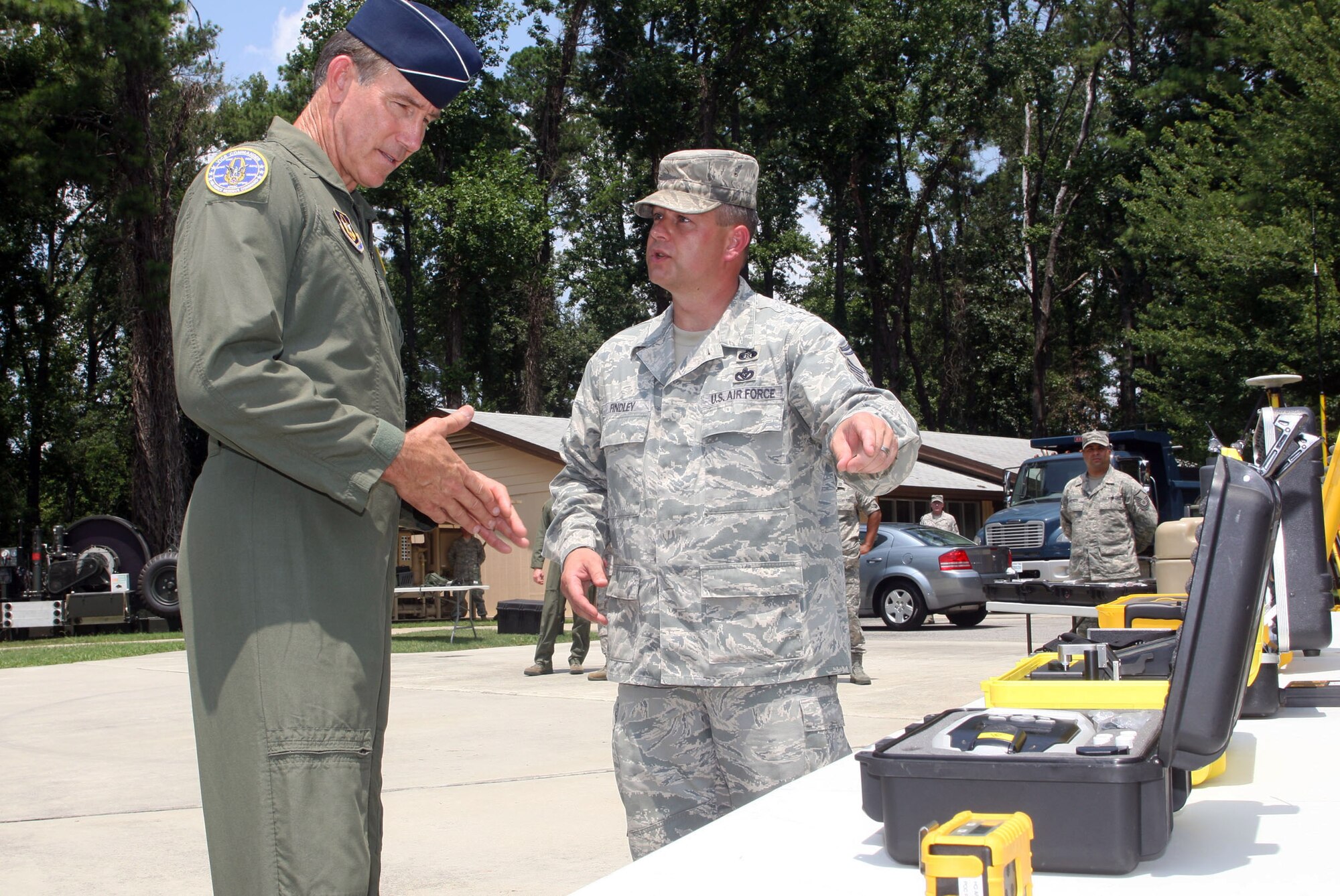 Maj. Gen Craig N. Gourley, vice commander, Headquarters Air Force Reserve Command is briefed on equipment used by Civil Engineer teams by Senior Master Sgt. Morris L. Findley, instructor at the Air Force Reserve Command Expeditionary Combat Support Training and Certification Center here Aug. 2. (U.S. Air Force Photo/Don Peek)
