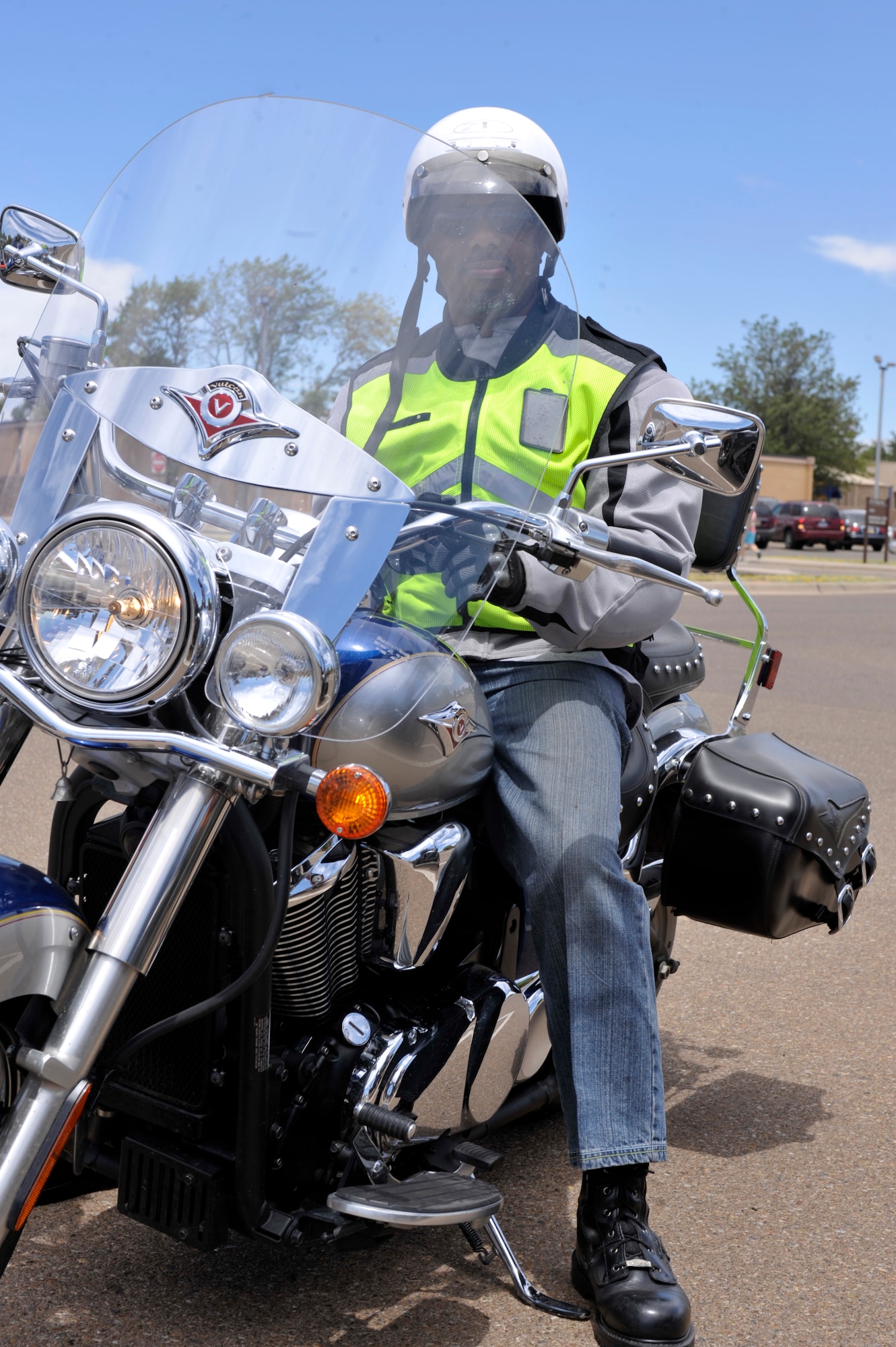Ken Sherrod, 27th Special Operations Medical Support Squadron, straddles his bike at the motorcycle safety rally in the Base Exchange parking lot at Cannon Air Force Base, N.M., Aug. 1, 2011. Sherrod is a member of the club that coordinated that event, the 27th Special Operations Wing Rolling Eagles motorcycle riders group. (U.S. Air Force photo by Airman Ericka Engblom) 