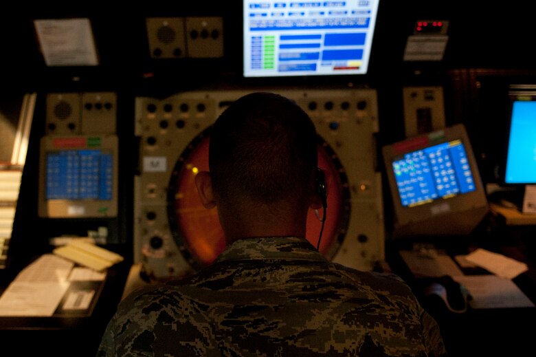 Senior Airman Jeffrey Giles, 39th Operations Squadron air traffic control journeyman, monitors a radar approach control screen Aug. 3, 2011, at Incirlik Air Base, Turkey. RAPCON airmen work with the Turkish air force to ensure the safe and smooth operation of all air traffic operations within 50 nautical miles of Incirlik. (U.S. Air Force photo by Airman 1st Class Clayton Lenhardt/Released)