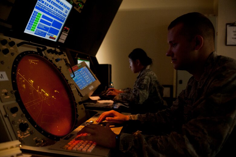 Senior Airman Jeffrey Giles, 39th Operations Squadron air traffic control journeyman, and Tech. Sgt. Rosalyn Reola, 39th OS radar approach control watch supervisor, monitor RAPCON screens Aug. 3, 2011, at Incirlik Air Base, Turkey. RAPCON airmen work with the Turkish air force to ensure the safe and smooth operation of all air traffic operations within 50 nautical miles of Incirlik. (U.S. Air Force photo by Airman 1st Class Clayton Lenhardt/Released)