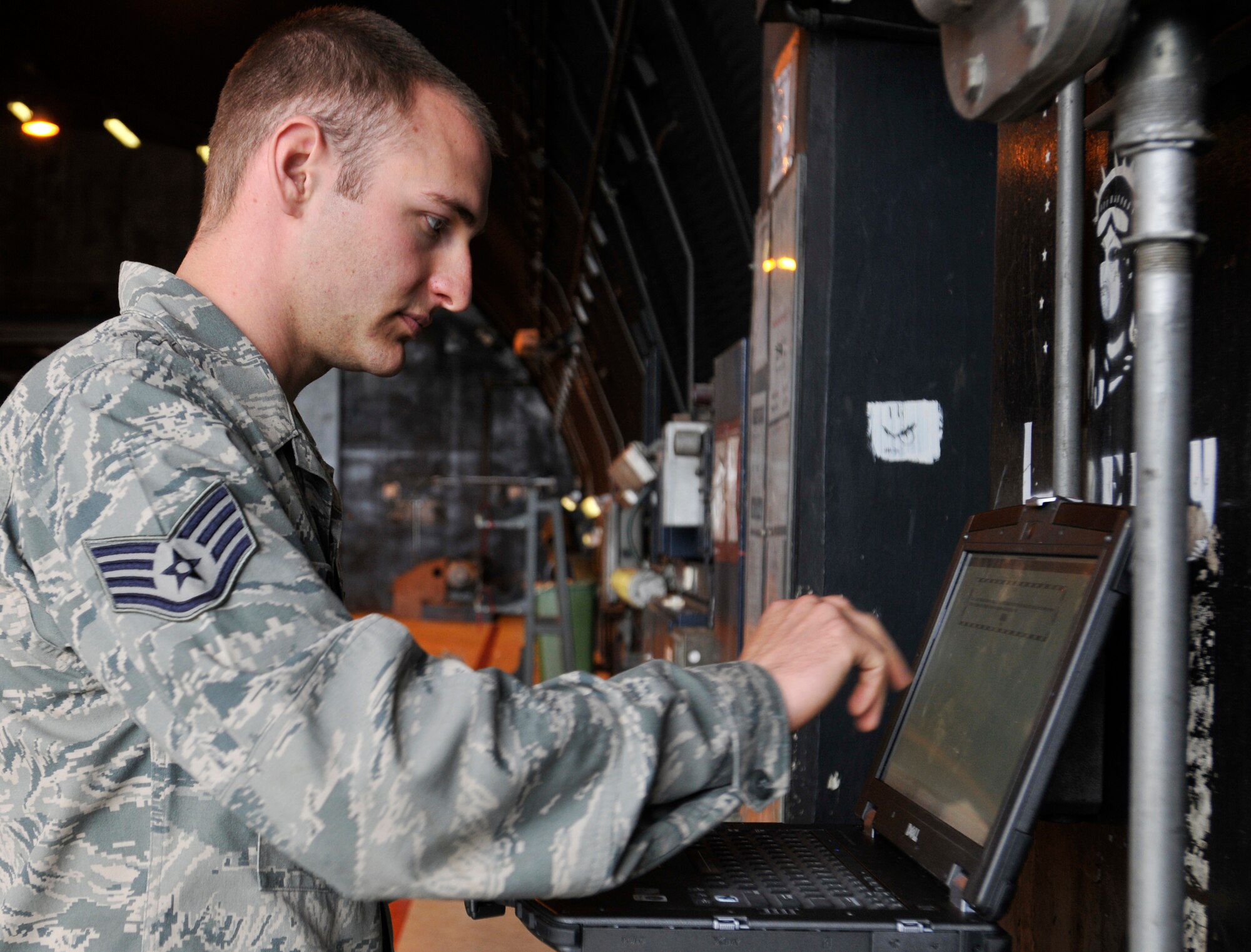 ROYAL AIR FORCE LAKENHEATH, England - Staff Sgt. Trevor Knapp, 48th Equipment Maintenance Squadron Nondestructive Inspection journeyman, reviews data prior to an aircraft inspection at RAF Lakenheath, Aug. 2, 2011. Airmen from the NDI are responsible for finding the smallest aircraft defects so they can be repaired to prevent larger problems. (U.S. Air Force photo/Senior Airman Tiffany M. Deuel)