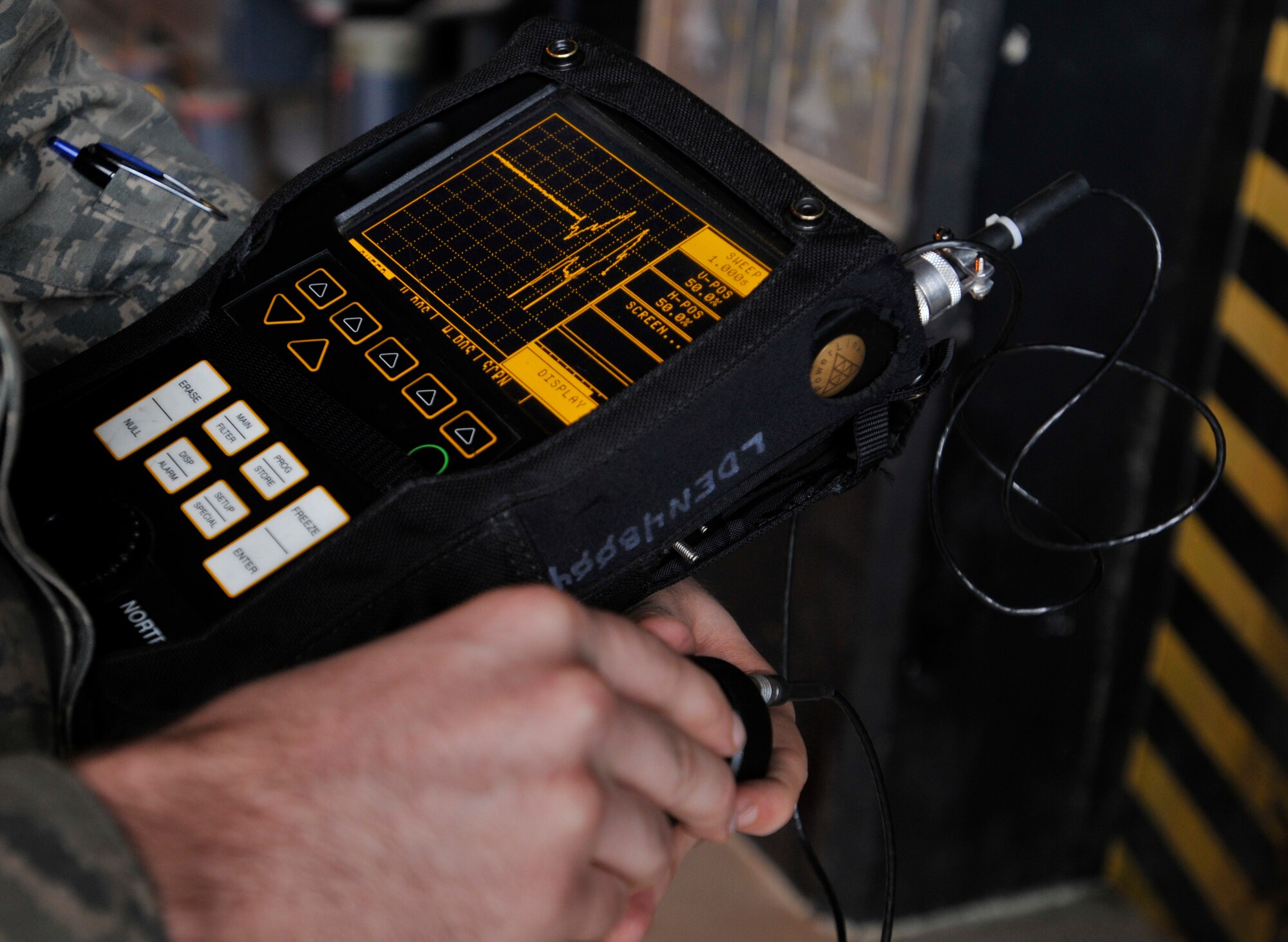 ROYAL AIR FORCE LAKENHEATH, England - Staff Sgt. Michael Sommer, 48th Equipment Maintenance Squadron Nondestructive Inspection journeyman, calibrates a Nortec 2000D+ eddy current flaw detector prior to an aircraft inspection at RAF Lakenheath, Aug. 2, 2011. The device detects sub-surface and surface breaking cracks in the aircraft. Airmen from the NDI are responsible for finding the smallest aircraft defects so they can be repaired to prevent larger problems. (U.S. Air Force photo/Senior Airman Tiffany M. Deuel)