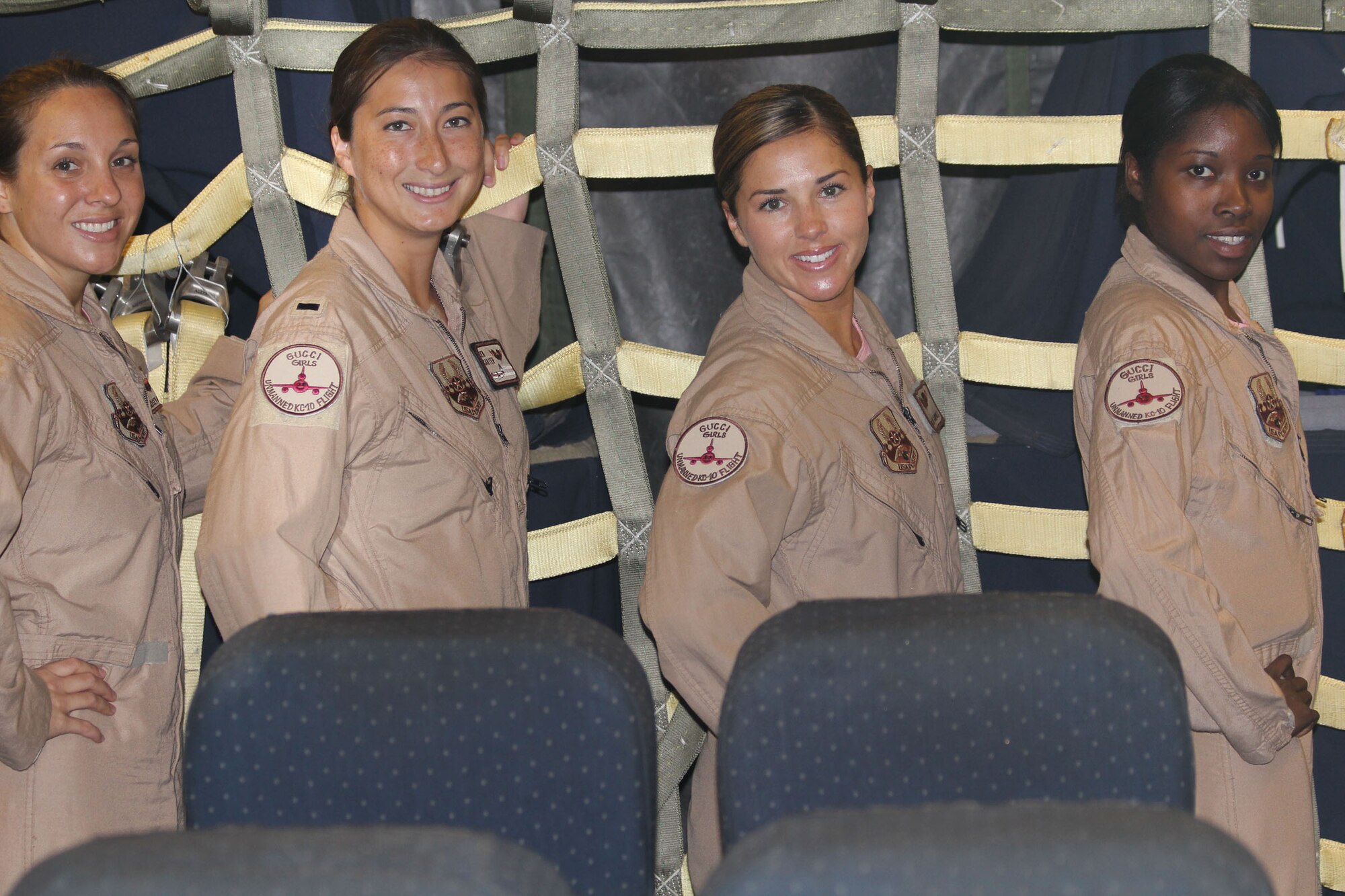 Capt. Lindsey Bauer, aircraft commander, 1st Lt. Jen Carter, pilot, Staff Sgt. Lindy Campbell, boom operator and Staff Sgt. Sarah Lockley, flight engineer, from the 908th Expeditionary Air Refueling Squadron in Southwest Asia, participate in an ?unmanned? aerial refueling mission in the KC-10 Extender, Aug. 2, 2011. The deployed environment admittedly is a mostly male world. For a day though, the deployed KC-10 crew made it an all-female day, as all four crew positions were held by females, truly making their mission "unmanned." This crew composition is rare because Lockley is the only female KC-10 flight engineer in the Air Force. (U.S. Air Force photo/Staff Sgt. Patrick Mitchell)