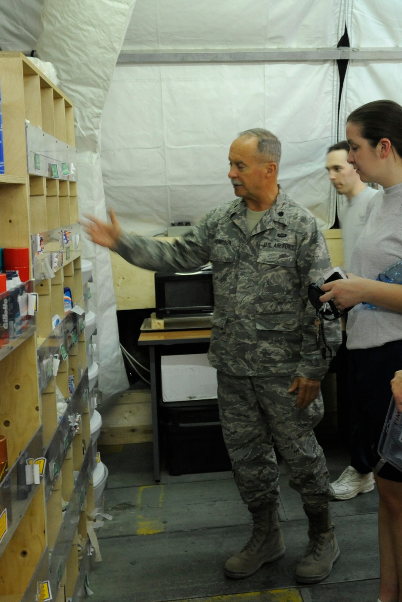 Chaplain (Lt. Col.) Steve Thompson shows guests at the chapel the variety of free hygiene products available to those transiting through or assigned to the Transit Center Aug. 3. The six-person chapel staff hosts 23 services each week, targeted toward four faith groups. Thompson is the 376th Air Expeditionary Wing chaplain. He is deployed here from the Florida Air National Guard’s 125th Fighter Wing. (U.S. Air Force photo/Tech. Sgt. Tammie Moore)