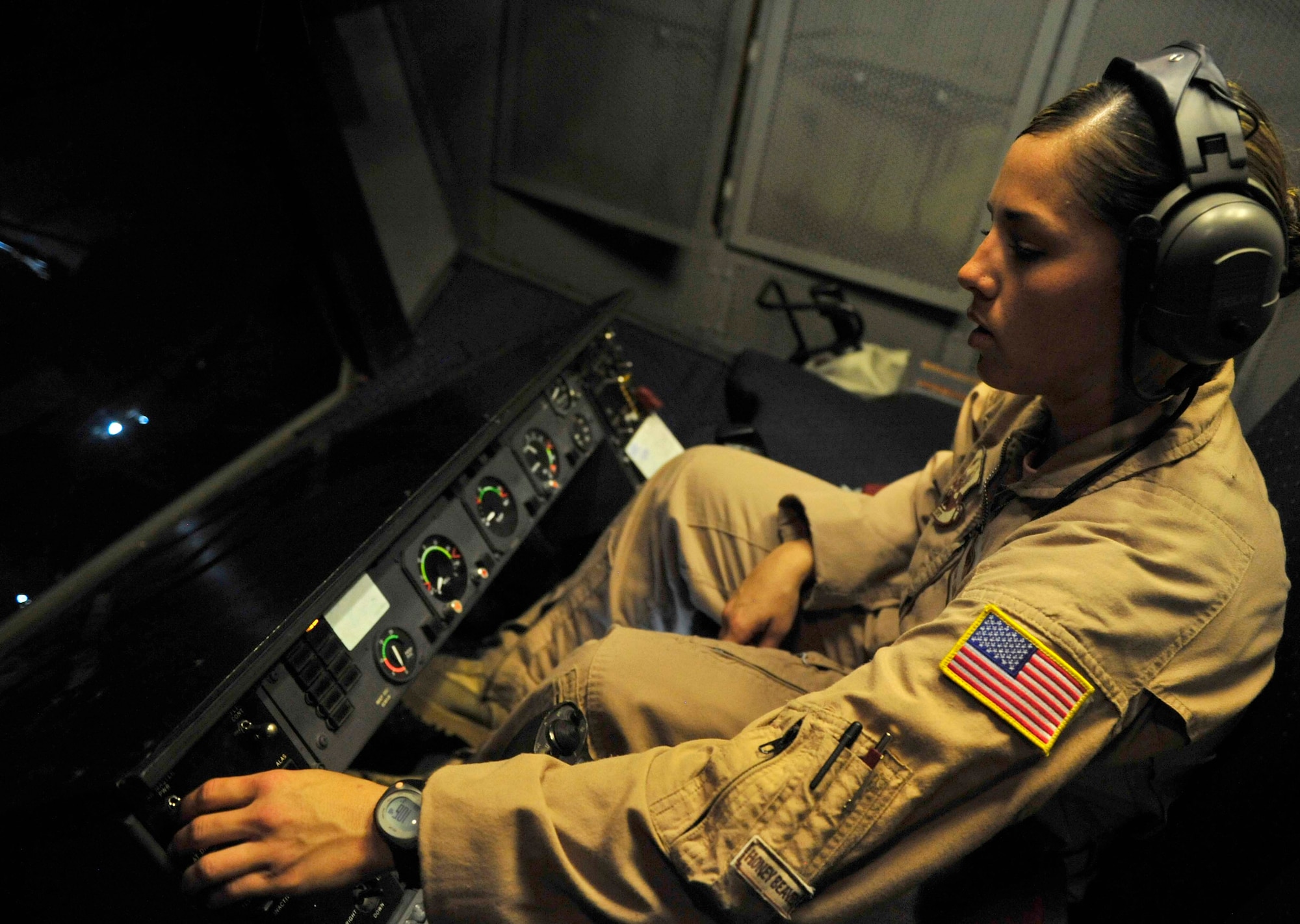 The deployed environment admittedly is a mostly male world. For a day though, a deployed KC-10 Extender crew made it an all-female day, as all four crew positions were held by females, truly making their mission ?unmanned.? Staff Sgt. Lindy Campbell, a boom operator and flight air refueler, with the 908th Expeditionary Air Refueling Squadron. A boom operator controls refueling operations through a digital,  fly-by wire system. Sitting in the rear of the aircraft, the operator can see the receiver aircraft through a wide window.    (U.S. Air Force photo/Staff Sgt. Patrick Mitchell)