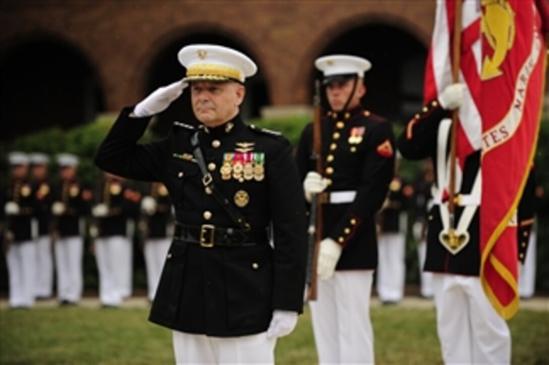 Vice Chairman Joint Chiefs of Staff Gen. James E. Cartwright salutes during the playing of the national anthem during a farewell ceremony in his honor at Marine Corps Barracks, Washington, D.C., on Aug. 3, 2011.  