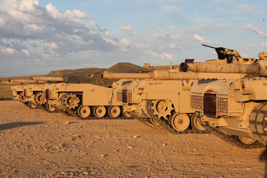 An M1A1 Abrams Tanks sit and a wait activation to begin a new day of fire during the 9th annual Tiger Platoon Tank Competition 2011, August 4.