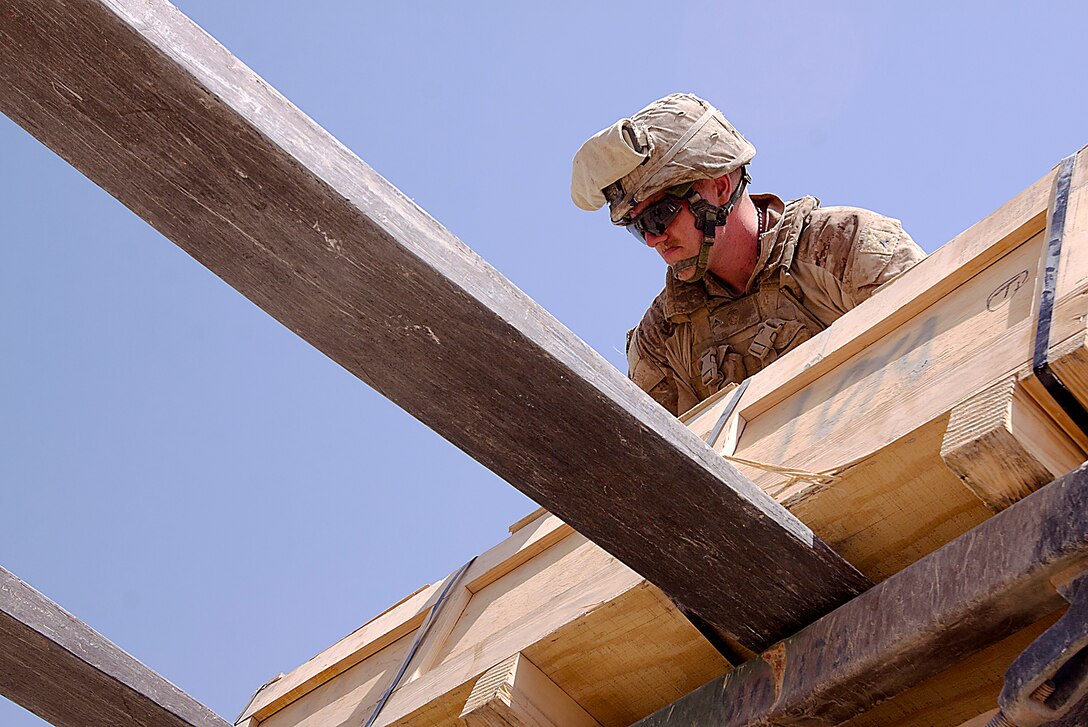 Lance Cpl. Gregory Houser loads a crate of supplies onto a tram here, Aug. 4. Houser, a native of Bristol, Tenn., is a gunner and driver for 3rd Trucks Platoon. Originating from Marine Corps Bases Japan, 3rd Trucks Platoon is attached to 1st Battalion, 3rd Marine Regiment. Trucks Platoon is responsible for logistical deliveries throughout 1/3’s area of operations.