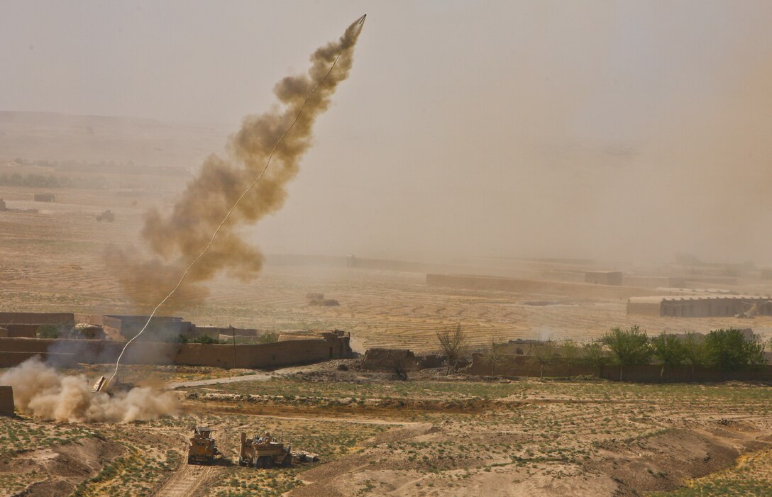 An assault breaching vehicle with 2nd Combat Engineer Battalion fires a line charge to clear Improvised Explosive Devices in and around the Ladar Bazaar.  The charge is comprised of 1,750 pounds of C4 explosive and is spread along a 350-foot rope.