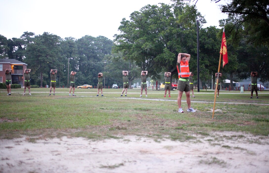U.S. Marines with 26th Marine Expeditionary Unit conduct warm up exercises during a command physical training session on Camp Lejeune, N.C., Aug. 5, 2011. The 3.9 mile run was led by the 26th MEU commanding officer, Col. Matthew St. Clair, and 26th MEU sergeant major, Sgt. Maj. Todd. M. Parisi. (U.S. Marine Corps photo by Gunnery Sgt. Michael K. Kropiewnicki)