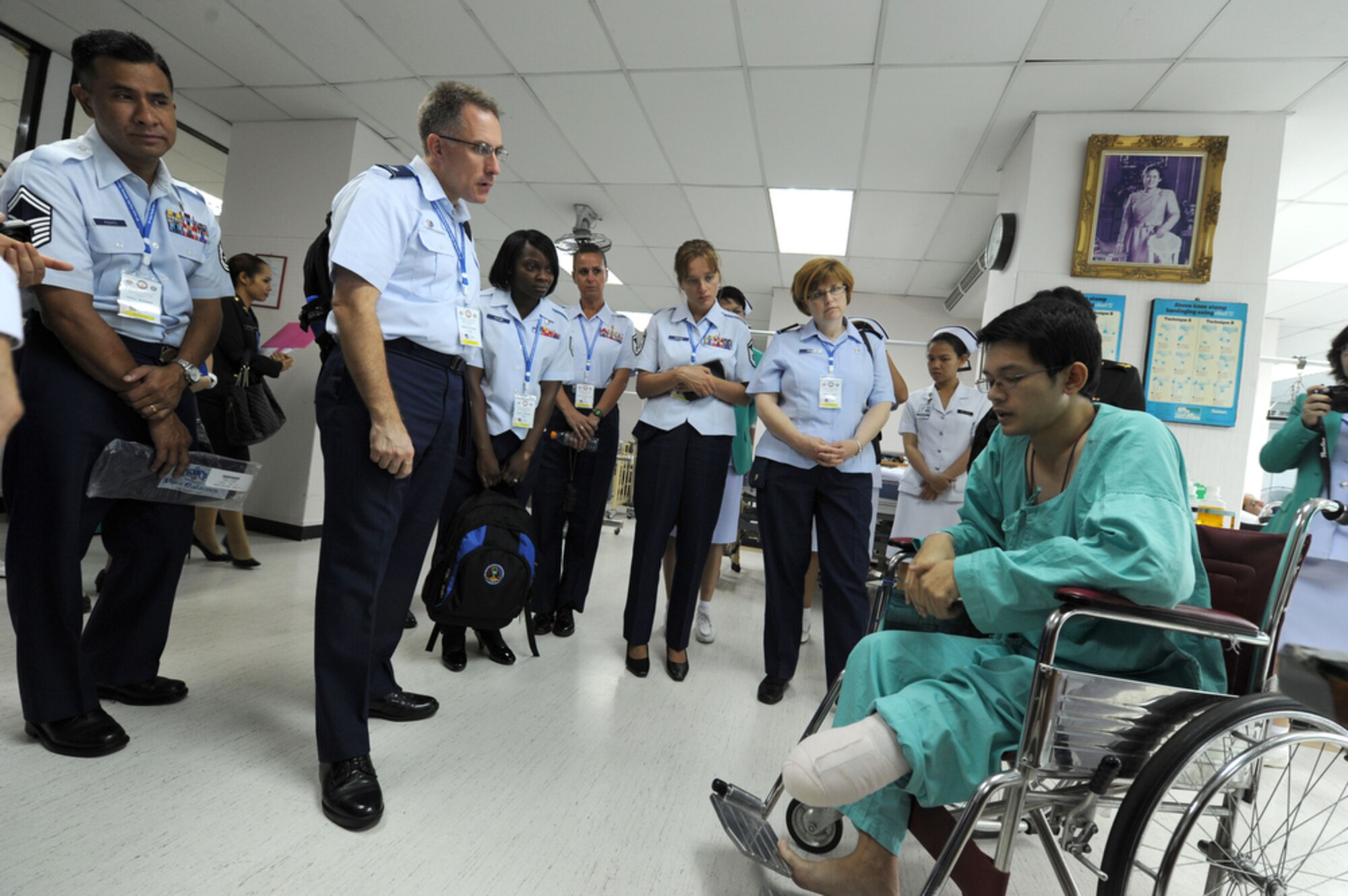 BANGKOK, Thailand - Lt Col. Mike Ross (center) listens as a soldier from the Royal Thai Army explains how he lost his foot when stepping on a land mine during conflicts in southern Thailand. Ross, along with other members of the military nursing community in the Pacific region gathered at the Phramongkutklao Hospital in Bangkok Thailand on Aug. 3 for a tour of the Hospital facilities during the 2011 Asia Pacific Military Nursing Symposium, which is sponsored by Pacific Command and executed under the direction of 13th Air Force.
This is the fifth year of the symposium, which started at Hickam Air force Base in 2007, and the first time that Thailand has hosted the event.
More than 12 countries from the Asia-Pacific region have come together to build on relationships by exchanging information and techniques with one another. (U.S.  Air Force photo/Master Sgt. Cohen A. Young)
