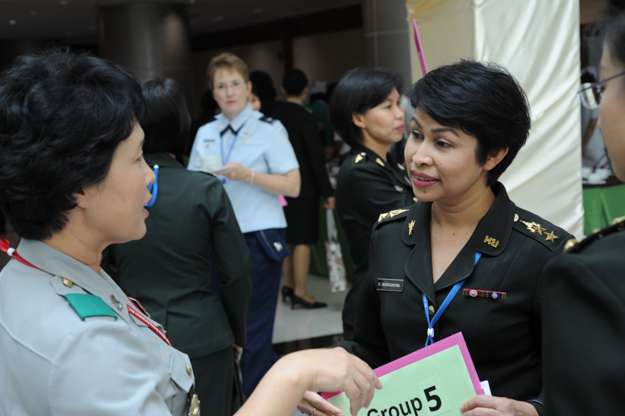 BANGKOK, Thailand - A nurse from the Republic of Korea speaks with a member of the Royal Thai Army Nursing College before the start of a tour at the Phramongkutklao Hospital in Bangkok Thailand on Aug. 3 during the 2011 Asia Pacific Military Nursing Symposium, which is sponsored by Pacific Command and executed under the direction of 13th Air Force.
This is the fifth year of the symposium, which started at Hickam Air force Base in 2007, and the first time that Thailand has hosted the event.
More than 12 countries from the Asia-Pacific region have come together to build on relationships by exchanging information and techniques with one another. (U.S.  Air Force photo/Master Sgt. Cohen A. Young)
