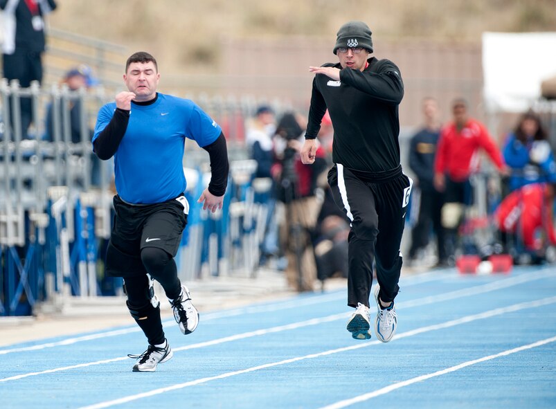 A WILD RIDE - Matthew Bilancia, left, competes in the 1,600 meter run held at the Air Force Academy, Colo., during the Warrior Games. (Photo by TSgt Samuel Bendet)