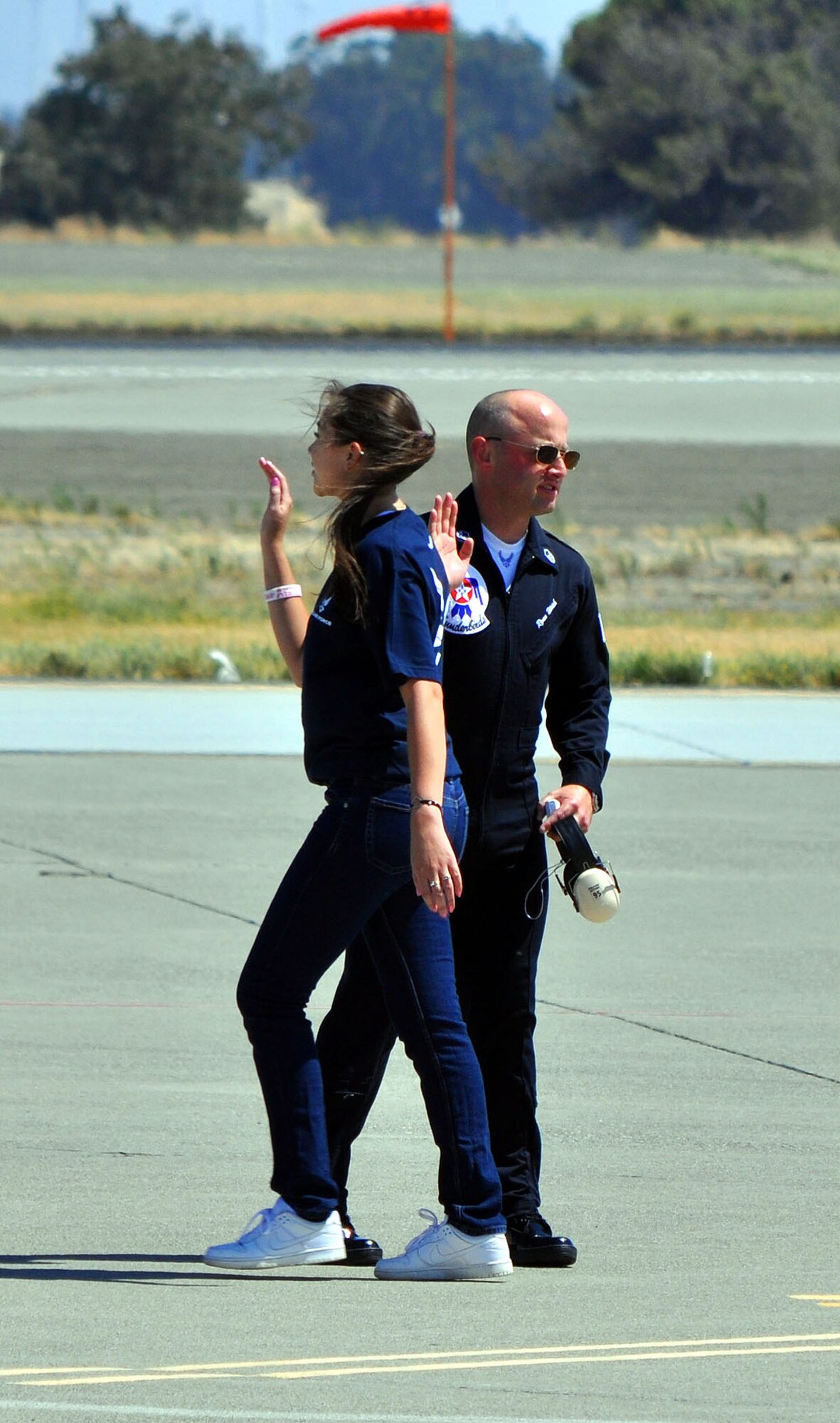TRAVIS AIR FORCE BASE, Calif. -- One of the elite maintenance team of the U.S. Air Force Thunderbirds "high fives" a new Air Force enlistee July 30. More than 60 young men and women stood as a group on the Travis AFB flight line, during the 2011 Air Power Expo, and were sworn into the Air Force. For those choosing the Reserve, Travis is one of five pilot bases launching a Delayed Enlistment Development and Training Flight. While awaiting a report date to basic military training, enlistees will report to the 349th Air Mobility Wing Flight Leader, Master Sgt. Heather Bradley, for training that will help them make the transition from civilian to Airman. Wearing blue Air Force Reserve tee shirts and blue jeans, they will report on Saturdays of A and B Flight UTA at 7:20 a.m., to the Airman Leadership School. Their curriculum will include uniform standards and inspections, drill and ceremony, Air Force heritage, physical training and more. Right now, there are about 80 enlistees in the program. Volunteers are sought to assist with the training and mentoring. Please contact Sergeant Bradley at 424-1693, or email her at heather.bradley@us.af.mil. (U.S. Air Force photo/Senior Master Sgt. Ellen L. Hatfield)

