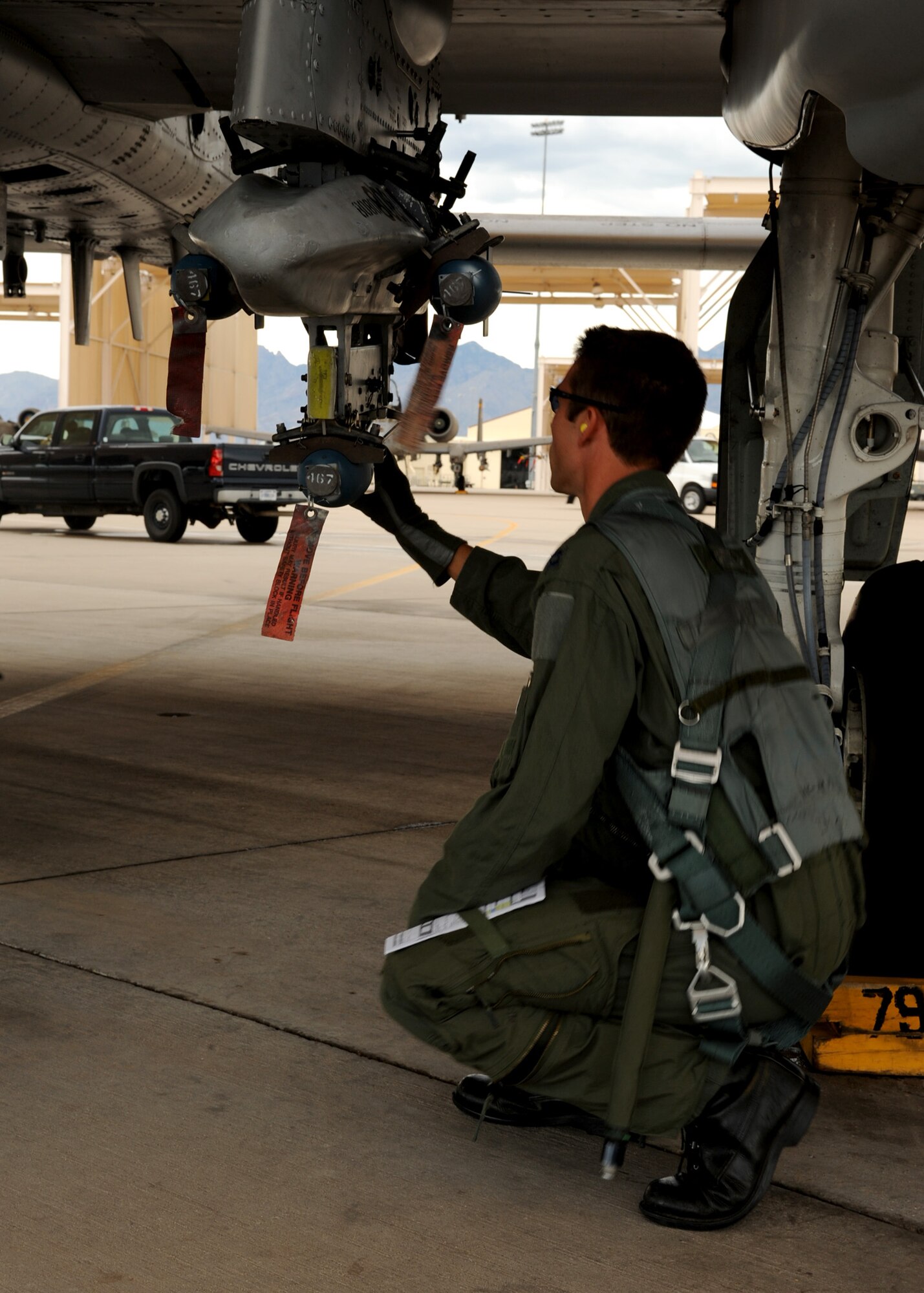DAVIS MONTHAN AIR FORCE BASE, Ariz. - Capt. Michael Fleming, 357th Fighter Squadron pilot, performs a pre-flight inspection on the A-10C on the flightline here Aug. 3. (U.S. Air Force photo/Airman 1st Class Christine Halan)