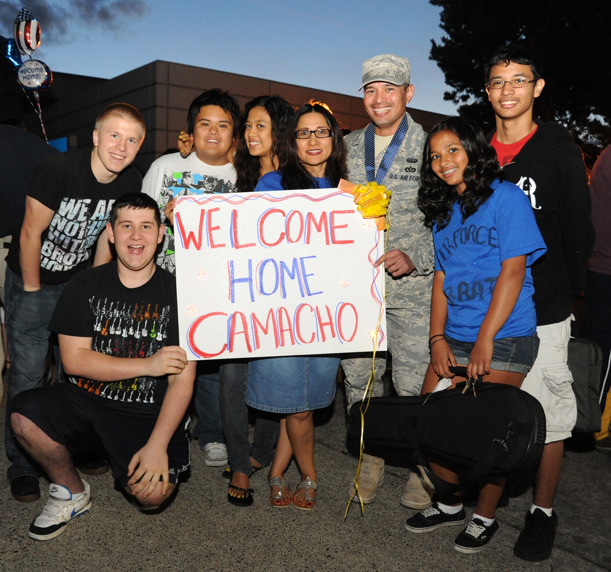 Oregon Air National Guard Tech. Sgt. Ricardo Camacho of the 116th Air Control Squadron is welcomed home by family and friends at the Portland Air National Guard Base, Portland, Ore., on July 20, 2011. Members of the 116th ACS, based out of Camp Rilea, Ore. have just returned from a four-mouth deployment to the Middle East. (U.S. Air Force photo by Tech. Sgt. John Hughel, 142 Fighter Wing public affairs) 

