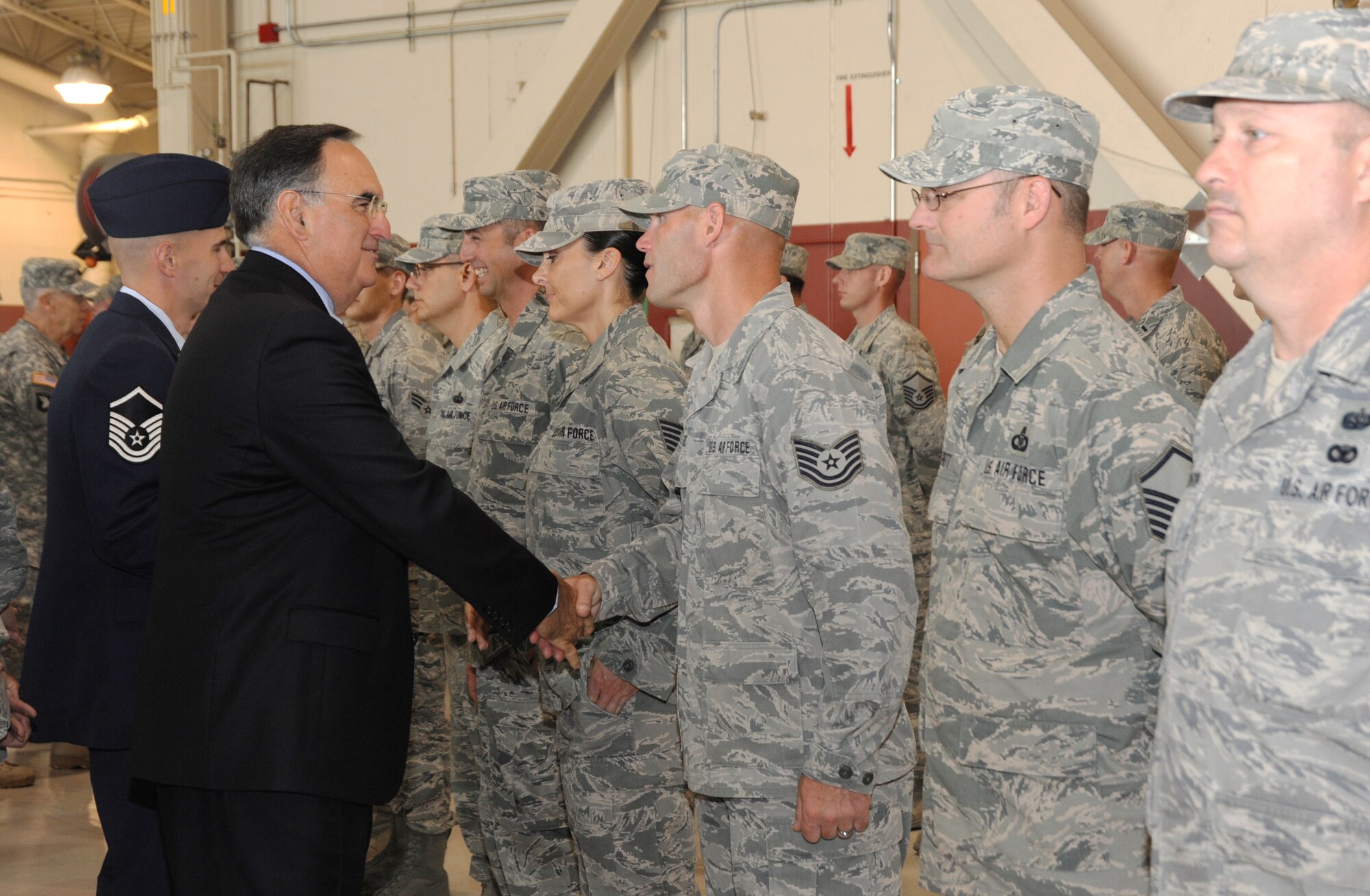 Oregon Chief Justice Paul De Muniz greets the Airmen of the 116 Air Control Squadron, on behalf of the Governor of Oregon, at a demobilization ceremony, July 24 at the Portland Air National Guard Base in Portland, Ore. Each of the Airmen recieved a Governors Coin in recognition of their accomplishments during the deployment. The Airmen recently returned from a four month deployment to the Middle East where they supported area operations in air control missions. (U.S. Air Force photo by Tech. Sgt. John Hughel, 142 Fighter Wing public affairs) 

