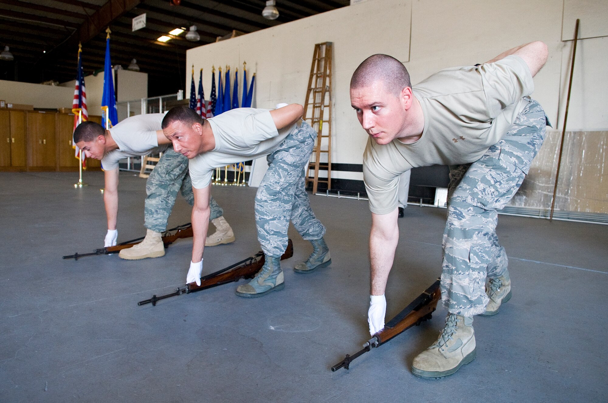 PATRICK AIR FORCE BASE, Fla. -- Patrick Honor Guard members practice rifle drills. HG is made up of volunteer members representing various Air Force units on Patrick AFB and Cape Canaveral AFS, who serve on one of three rotating flights, for one year minimum. Getting these Airmen trained and keeping them consistently sharp is a time-consuming, behind-the-scenes effort of HG Superintendent Master Sgt. Kevin Matthews and a team of professional full-time staff members, who augment, conduct day-to-day operations, training and assist with details. (U.S. Air Force photo by Julie Dayringer)