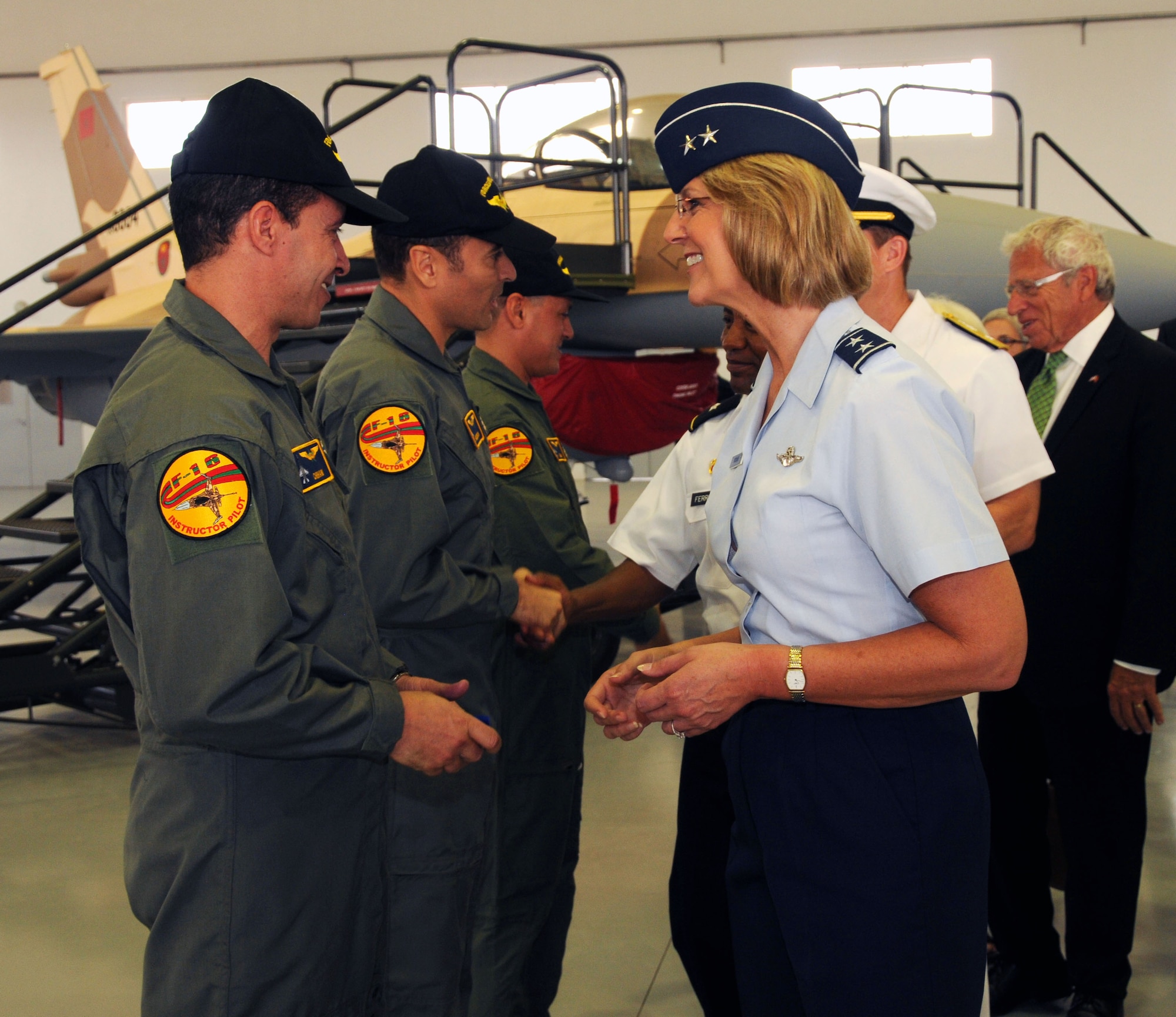 Maj. Gen. Margaret Woodward, Air Forces Africa (17th Air Force) commander, meets the first instructor pilots to graduate from U.S. led pilot training classes Aug. 4, 2011. The two-year program in Tucson, Arizona was designed to train and familiarize U.S. and international pilots with the F-16 Fighting Falcon. (Photo by U.S. Air Force Staff Sgt. Stefanie Torres)