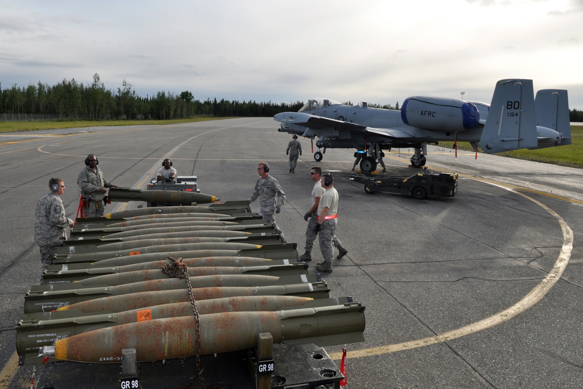 Some 917th Fighter Group maintenance personnel from Barksdale Air Force Base, La., load live Mk-82 weapons on an A-10 Thunderbolt II while deployed to Eielson Air Force Base, Alaska, in July 2011. Approximately 150 Airmen assigned to the 917th FG were in Alaska training for an upcoming air and space expeditionary forces rotation. (U.S. Air Force Photo/Senior Master Sgt. Jessica D'Aurizio)