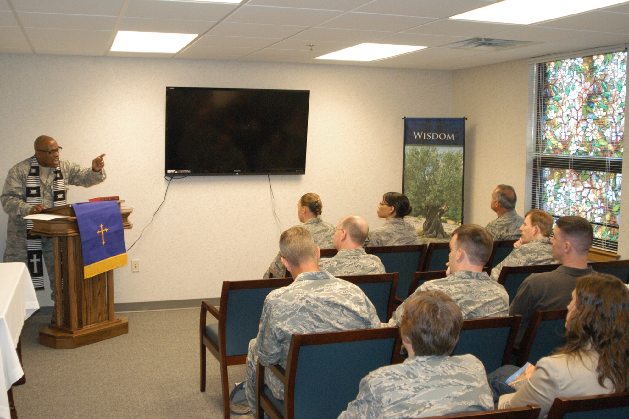 GRISSOM AIR RESERVE BASE, Ind. -- Chaplain (Maj.) Obadiah Smith, 434th Air Refueling Wing chaplain, preaches a sermon in the new chapel facility located in Bldg. 431. Protestant services are held at 11 a.m. on Sundays of the primary unit training assembly, and Catholic services held at 12:15. (U.S. Air Force photo/Senior Airman Andy McLaughlin)