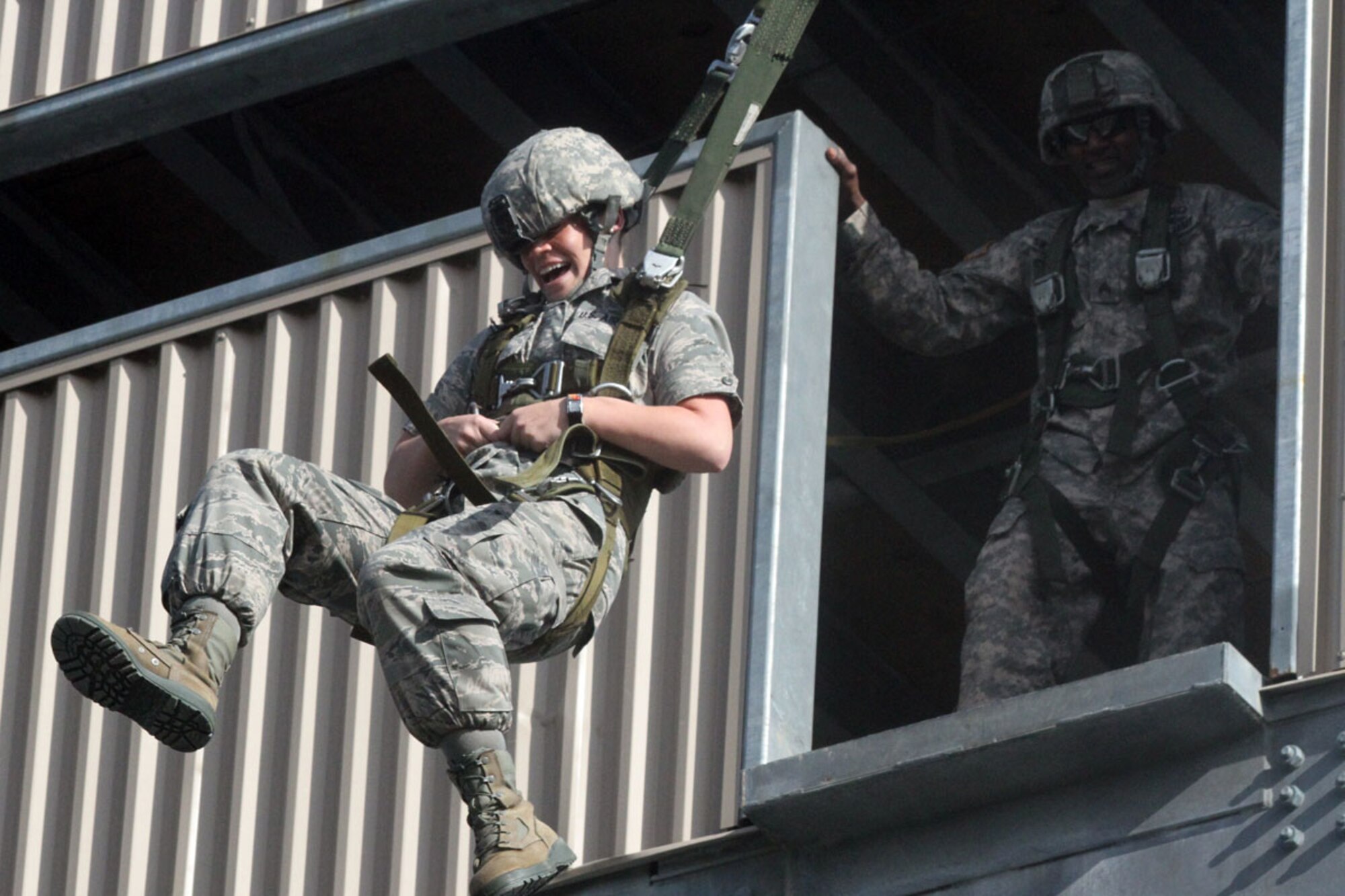A cadet with the University of Alaska-Anchorage ROTC program demonstrates a jump from the 34-foot Airborne Sustainment Training tower at Joint Base Elmendorf-Richardson, July 29. (U.S. Army photo/Staff Sgt. Jason Epperson)