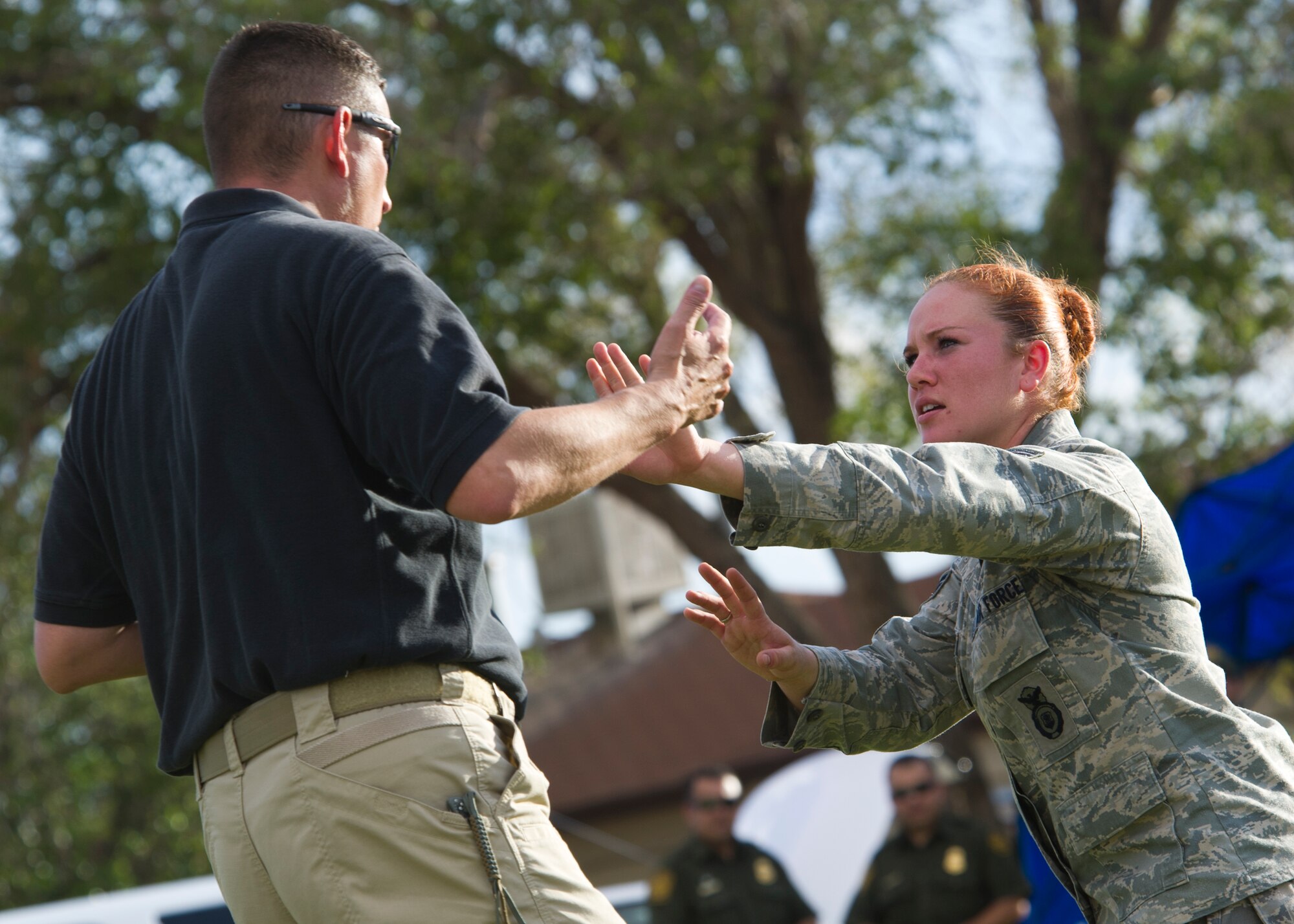 HOLLOMAN AIR FORCE BASE, N.M. -- U.S. Air Force Senior Airman Crystal Niles, 49th Security Forces Squadron, demonstrates an assertive self defense stance, Aug. 2, 2011, during the “National Night Out” event hosted by Soaring Heights. The event gave Airmen and their families prevention tips on securing their property and policing one another as well as looking for suspicious activity. (U.S. Air Force photo by Senior Airman Veronica Stamps/Released)