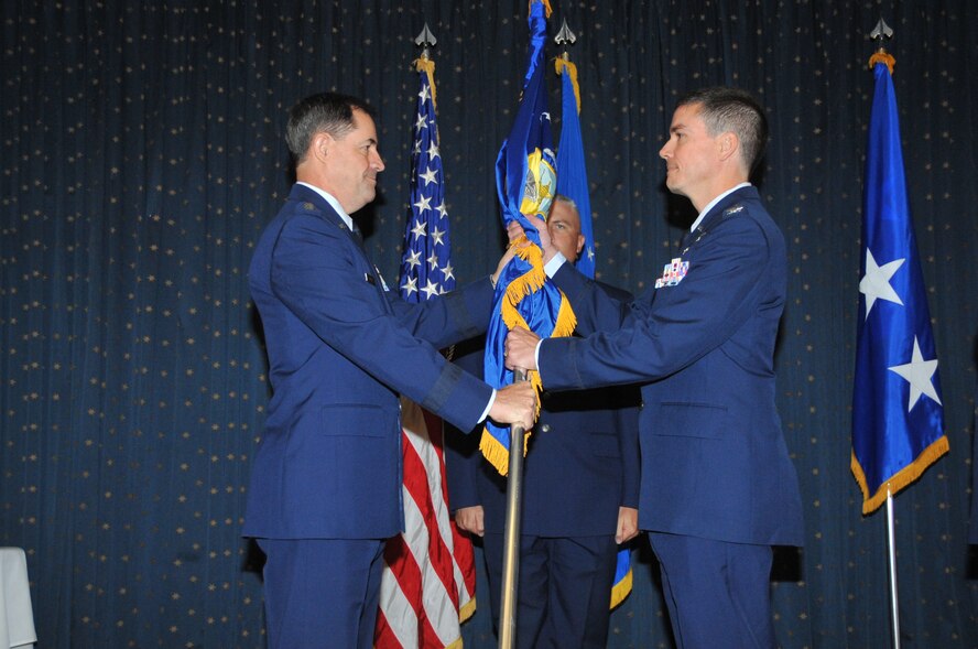 Lt. Gen. Marc E. Rogers, Inspector General of the Air Force, left, passes the guidon July 27 to Col. Paul W. Tibbets IV, the new commander of the Air Force Inspection Agency here.

Photo by Elizabeth Martinez
