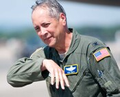 Col. Robert Swain Jr., 439th Airlift Wing commander, flew his final C-5 mission Aug. 3. Dozens of onlookers awaited the conclusion of the commander's fini flight, including his wife, Diane Swain, who used a large hose from the Westover Fire Department to douse her husband shortly after he stepped down the crew ladder from the C-5. The fini flight adds to the colonel's more than 3,500 hours flying C-5s and A-10s -- including 51 combat missions over Southwest Asia. Swain is the first pilot to score an air-to-air kill in an A-10 Thunderbolt II, when he downed an Iraqi helicopter during Operation Desert Storm. He will relinquish command of the 439th AW Aug. 6 to Col. Steven Vautrain. (US Air Force photo/W.C.pope)