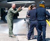 Col. Robert Swain Jr., 439th Airlift Wing commander, flew his final C-5 mission Aug. 3. Dozens of onlookers awaited the conclusion of the commander's fini flight, including his wife, Diane Swain, who used a large hose from the Westover Fire Department to douse her husband shortly after he stepped down the crew ladder from the C-5. The fini flight adds to the colonel's more than 3,500 hours flying C-5s and A-10s -- including 51 combat missions over Southwest Asia. Swain is the first pilot to score an air-to-air kill in an A-10 Thunderbolt II, when he downed an Iraqi helicopter during Operation Desert Storm. He will relinquish command of the 439th AW Aug. 6 to Col. Steven Vautrain. (US Air Force photo/W.C.pope)