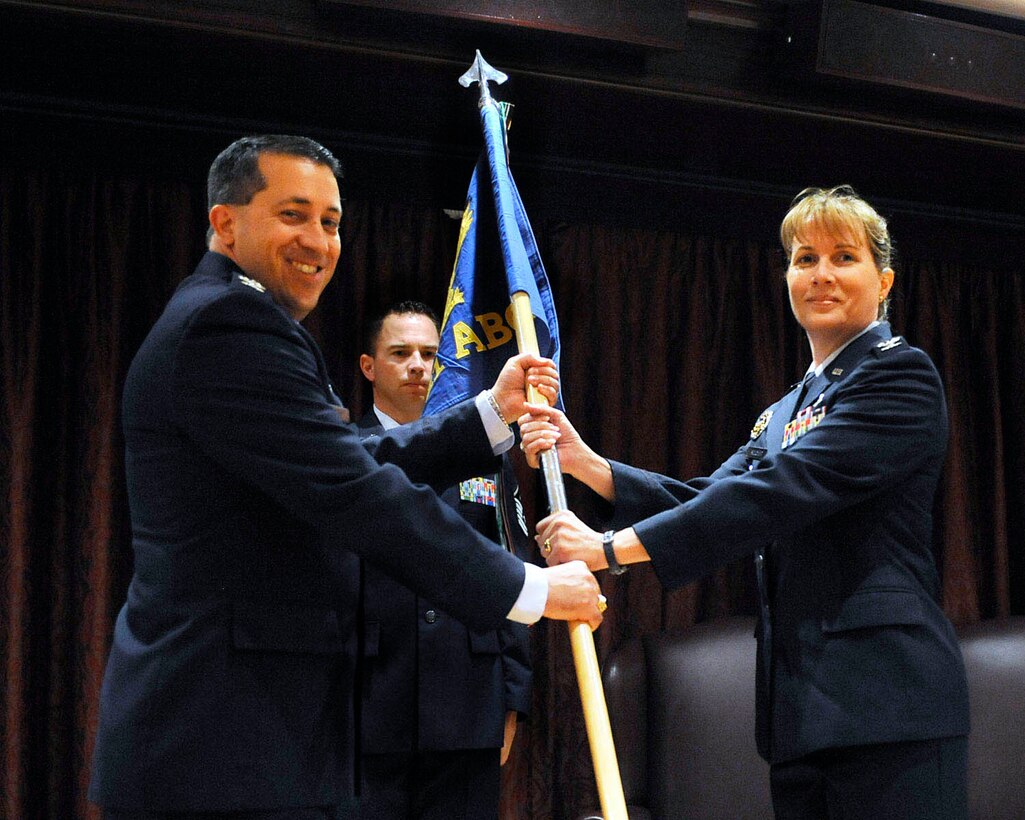 RAF MENWITH HILL, United Kingdom - Col. Mary Boucher is presented command of the 421st Air Base Group by Col. Brian Kelly, 501st Combat Support Wing commander, Aug. 2 during a change of command ceremony at RAF Menwith Hill. (U.S. Air Force photo by Staff Sgt. Ave Young)