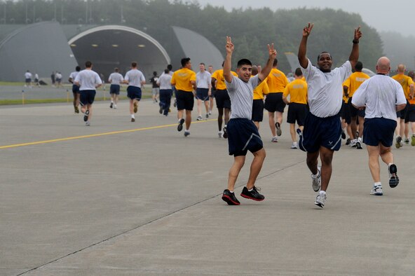 MISAWA AIR BASE, Japan -- Airmen celebrate their finish of the monthly readiness run held on the flightline Aug. 5th.  Readiness runs are not normally held on the flightline so this time runners had the opportunity to see a part of the flightline that they normally wouldn't get to see. (U.S. Air Force photo/Staff Sgt. Marie Brown)