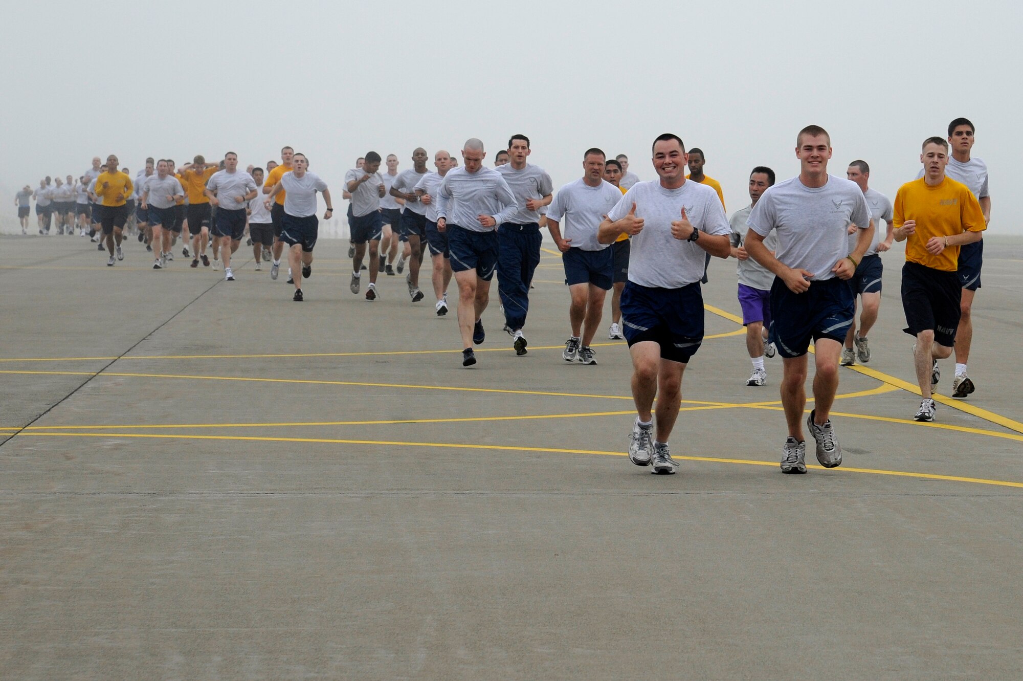 MISAWA AIR BASE, Japan -- An Airman gives two thumbs up during the monthly readiness run Aug. 5th. Runners had the choice between a 2 or 3 mile path. (U.S. Air Force photo/Staff Sgt. Marie Brown)