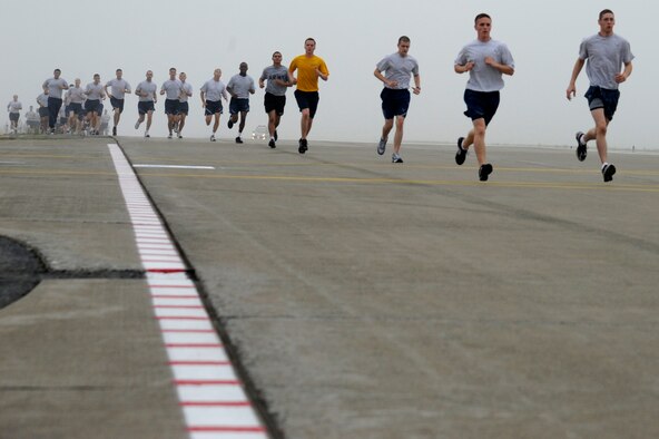 MISAWA AIR BASE, Japan -- Airmen and Sailors run on the flightline during the monthly readiness run Aug. 5th. This month's run was hosted by the 35th Maintenance Group and was held on the flightline. (U.S. Air Force photo/Staff Sgt. Marie Brown)