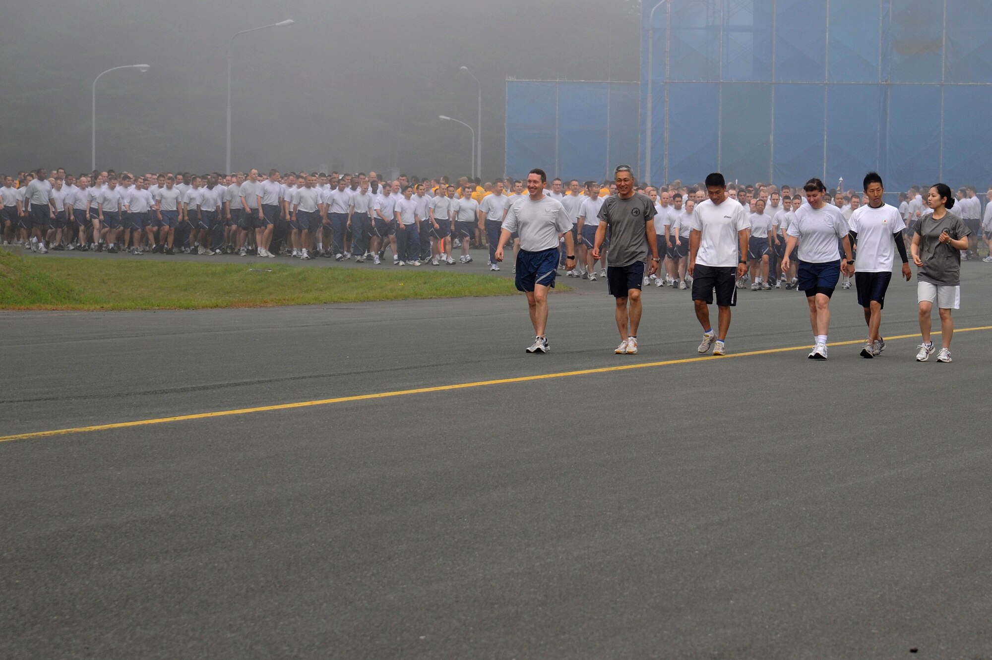 MISAWA AIR BASE, Japan -- The 35th Fighter Wing leadership along with the Japan Air Self-Defense Force leadership led the way during the monthly readiness run Aug. 5th. Readiness runs are not normally held on the flightline so, this month runners had the opportunity to see a part of the flightline that they normally wouldn't get to see. (U.S. Air Force photo/Staff Sgt. Marie Brown)