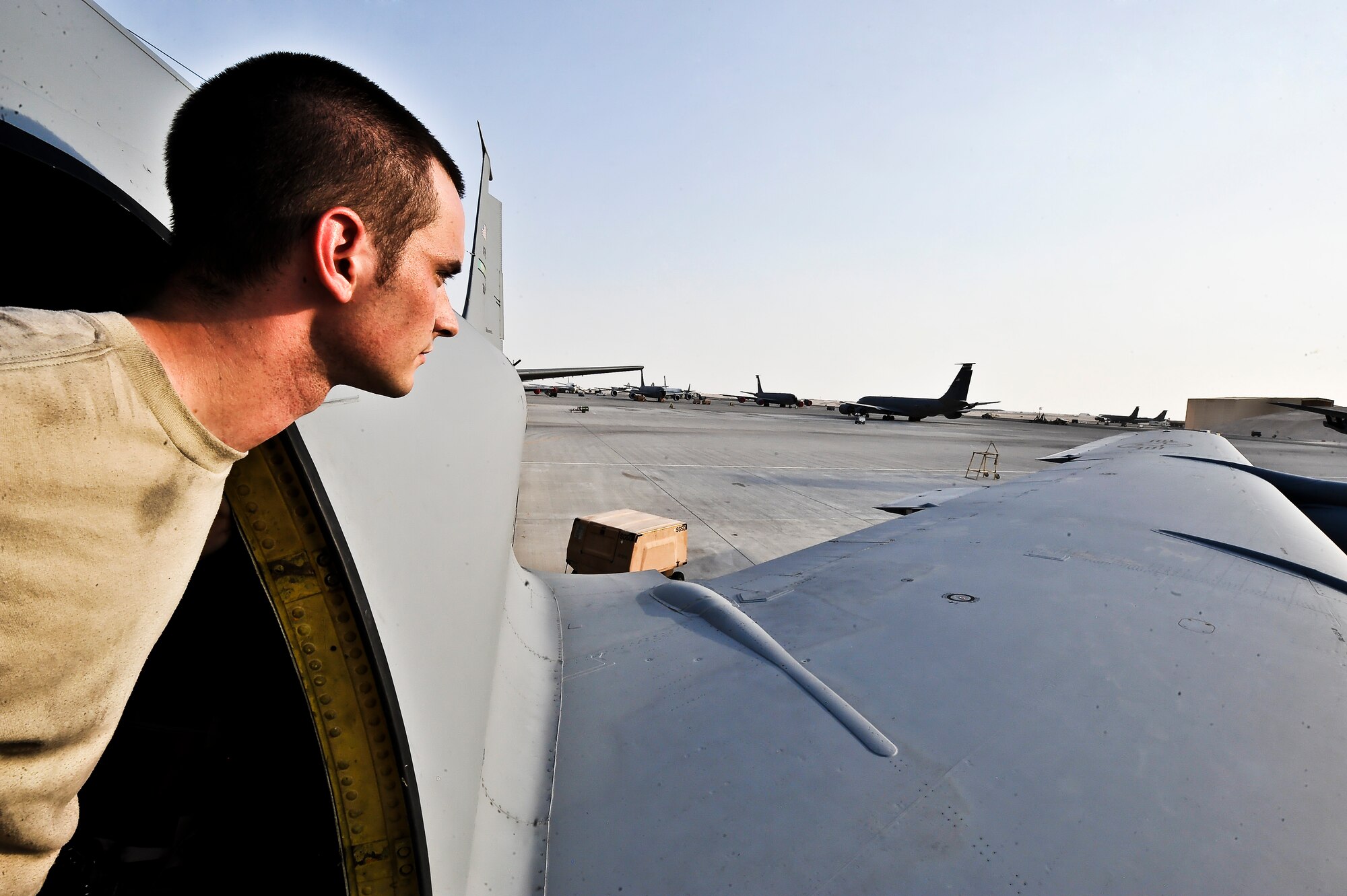 Senior Airman Michael Heasley, 340th Expeditionary Aircraft Maintenance Unit, inspects the wing of a KC-135 Stratotanker, July 31, at an undisclosed location in Southwest Asia.  Heasley is deployed from McConnell Air Force Base, Kan. (U.S. Air Force photo/Senior Airman Paul Labbe)