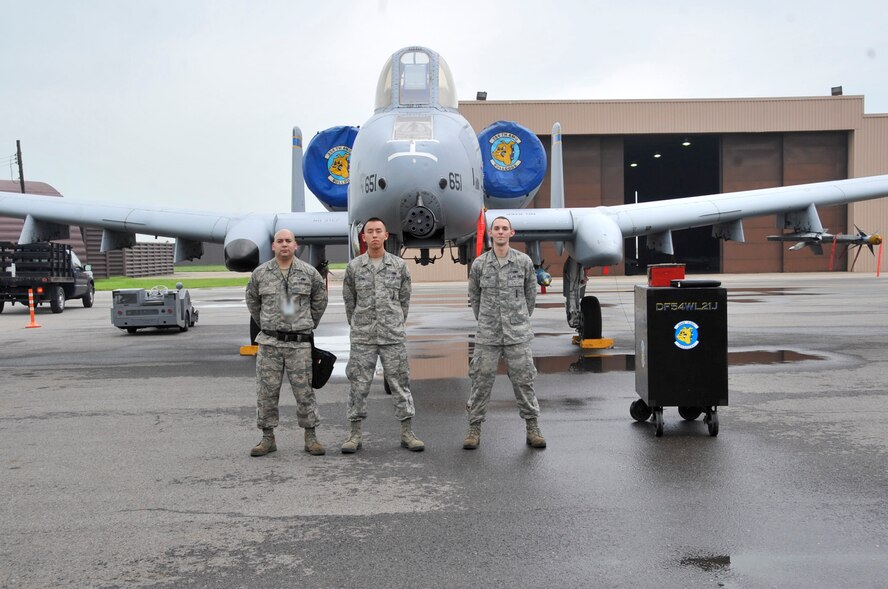From left to right the winners of the 51 Fighter Wing load crew competition Staff Sgt. Francisco Pio, Senior Airman James Xiong and Senior Airman David Stumpf. The competition had a time limit of 30 minutes and consisted of three aircraft two A-10s and one F-16 which was load with two bombs and one air to air missile. (U.S. Air Force Photos by/ Senior Airman Adam Grant)
