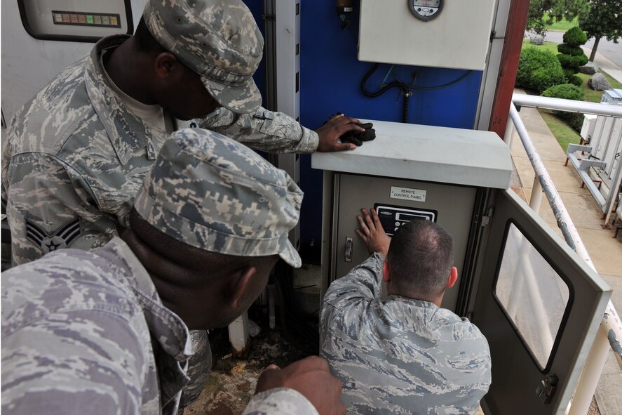 KUNSAN AIR BASE, Republic of Korea -- 8th Civil Engineer Squadron heating, ventilating, air conditioning and refrigerating technicians adjust system controls here Aug. 4. HVAC Airmen maintain 1.7K HVAC/R Systems base wide and assist the Army with specialized air conditioning equipment. (U.S. Air Force photo/Senior Airman Brittany Y. Bateman)